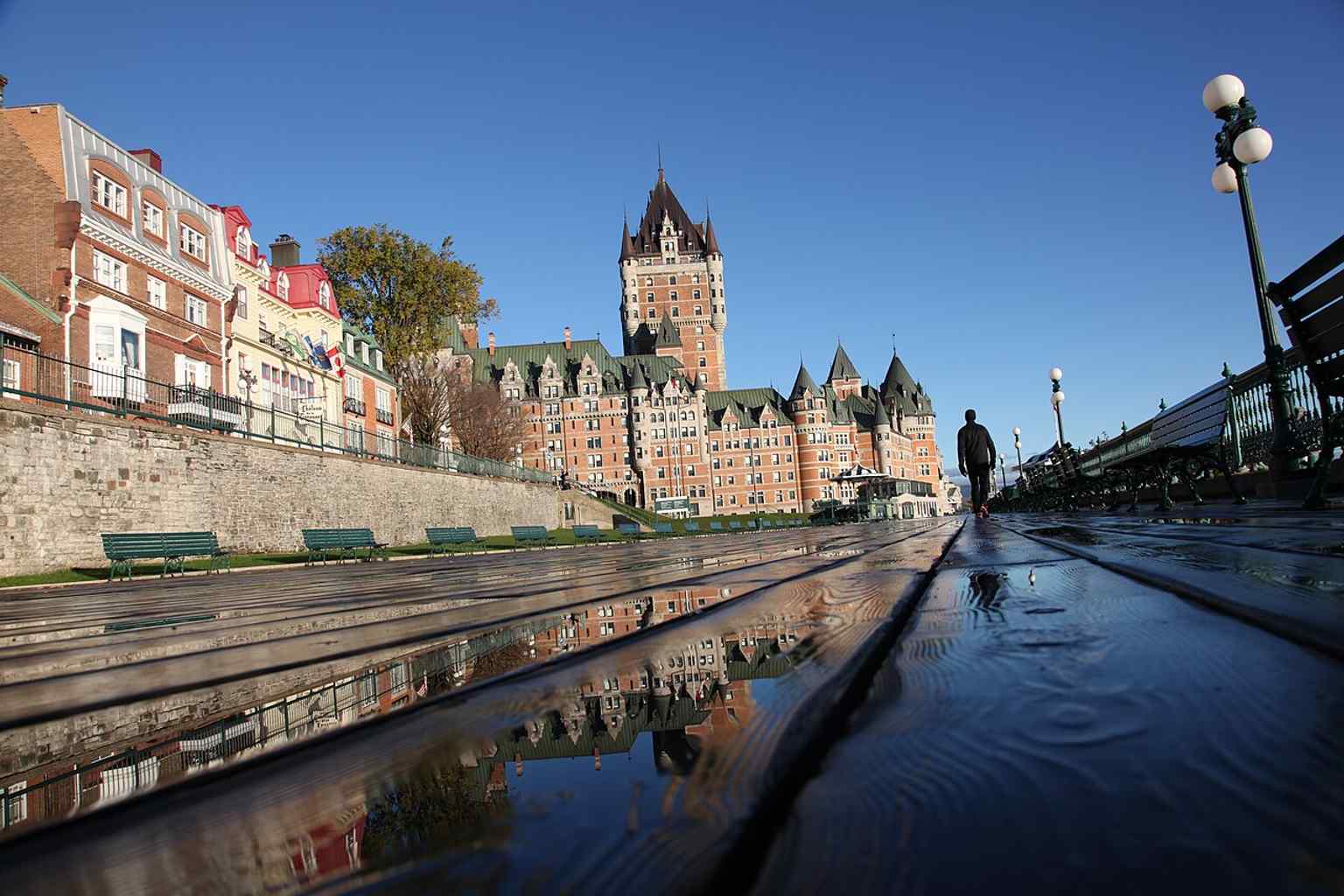 Seen from Terrasse Dufferin, this angle shows how the hotel crowns the promontory above the Saint Lawrence River and overlooks the old city below.