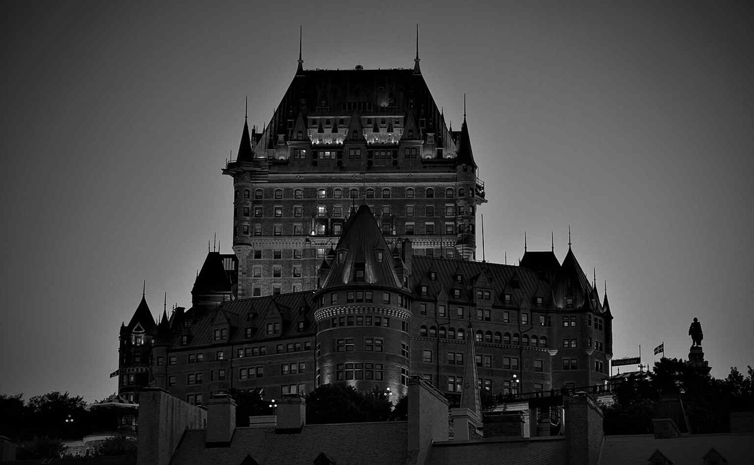 The Château Frontenac glowing at night — a dramatic reminder that its hilltop setting helped make it the “most photographed hotel in the world.”