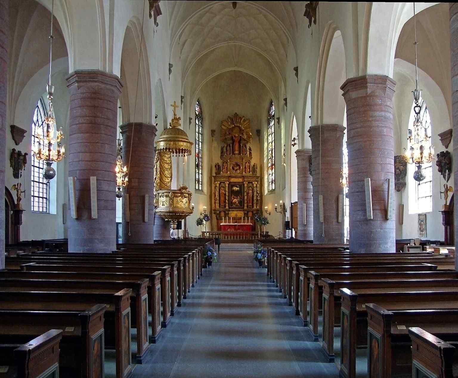 The nave of Jacob's Church features high, light vaults resting on massive pillars, creating a majestic interior space.