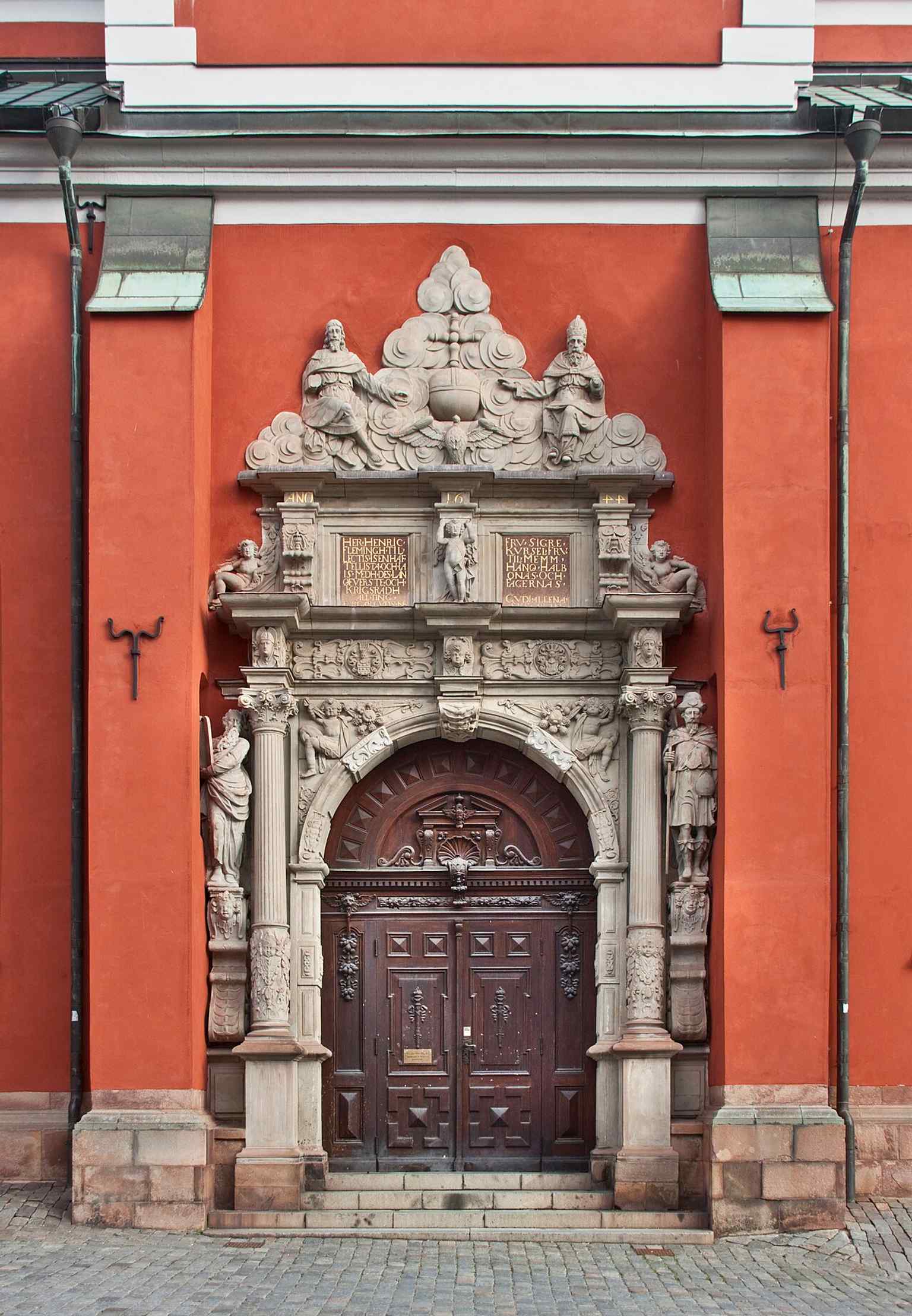 The lavish Southern portal, likely carved by Markus Hebel in 1644, features dynamic sculptures of St. Jacob and Moses, characteristic of its ornate Renaissance design.