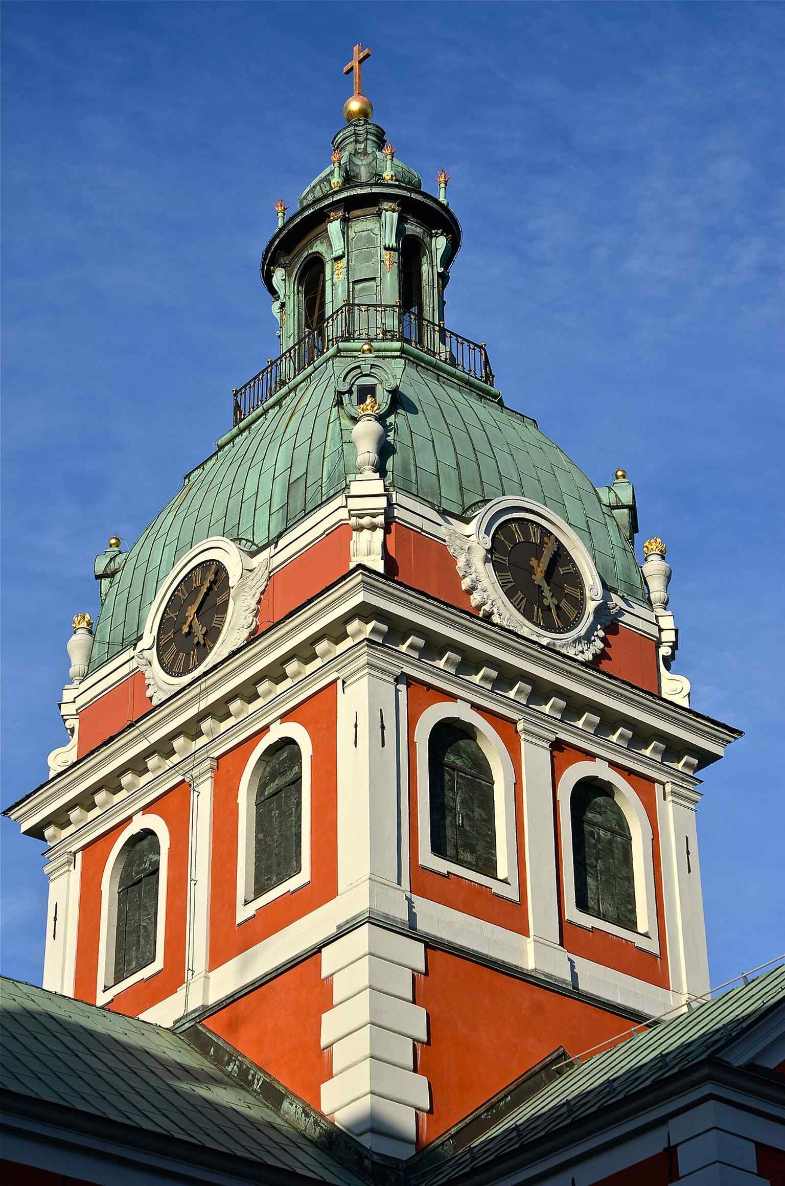 The church's Western facade, featuring its main entrance flanked by two smaller, octagonal towers, showcases elements of its 16th-century construction.