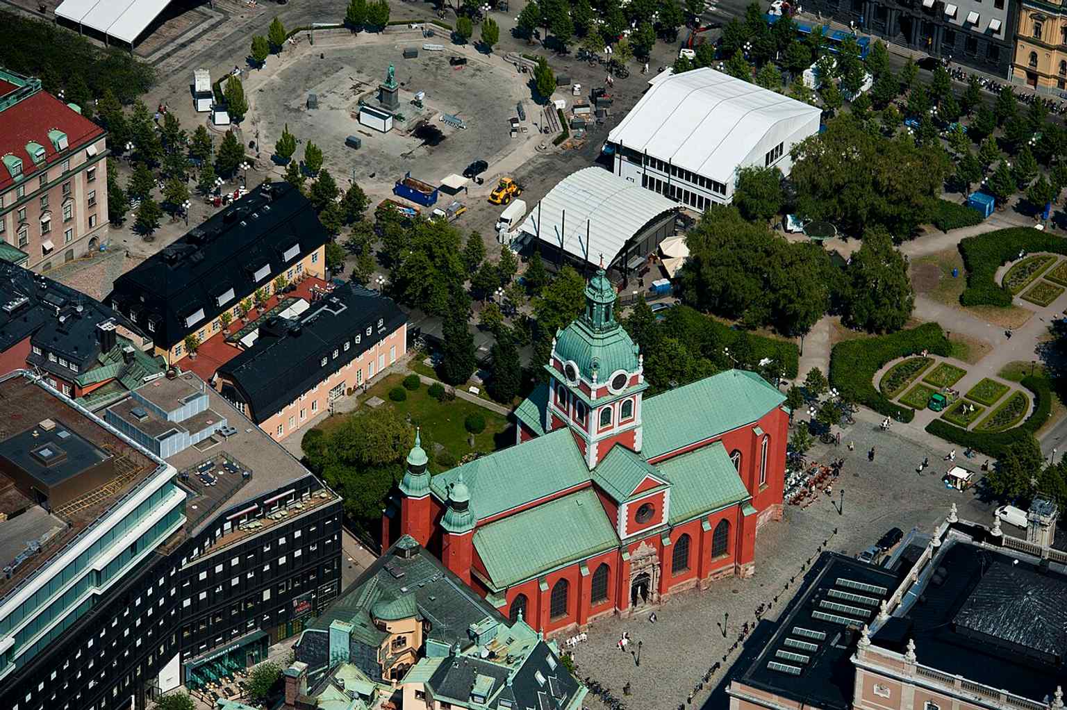 An aerial perspective reveals Jacob's Church's unique cruciform layout and central tower within the urban landscape of Stockholm.