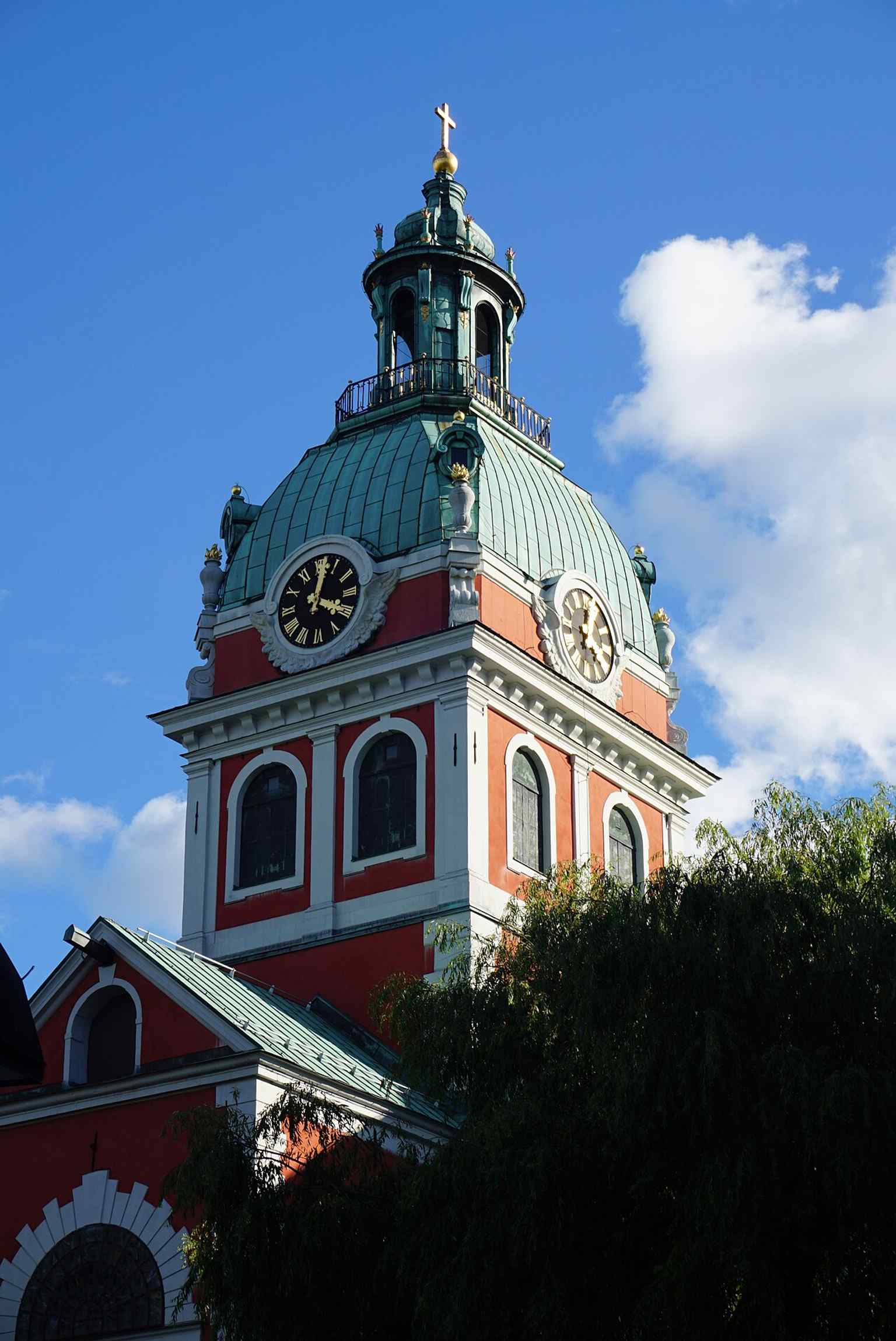 The distinctive copper-clad tower hood, an exceptional example of elaborate late Baroque design, was skillfully created by Carl Hårleman after the 1723 fire.