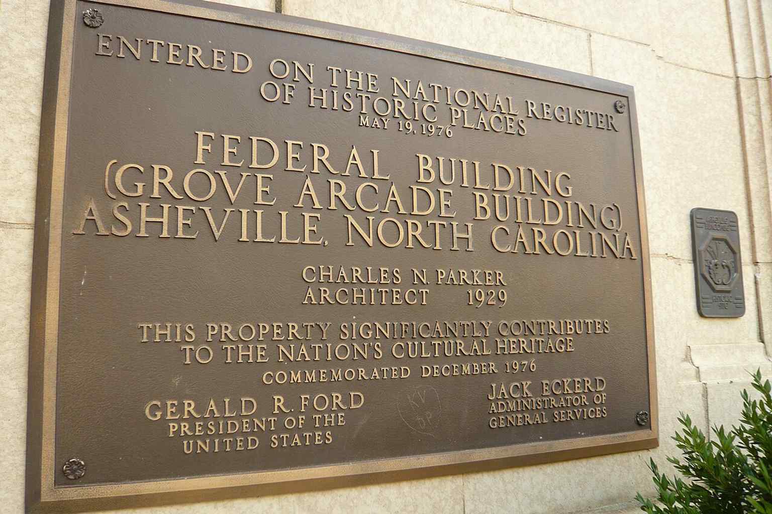 A historic plaque helps place the building on the National Register of Historic Places, recognizing its importance since 1976.