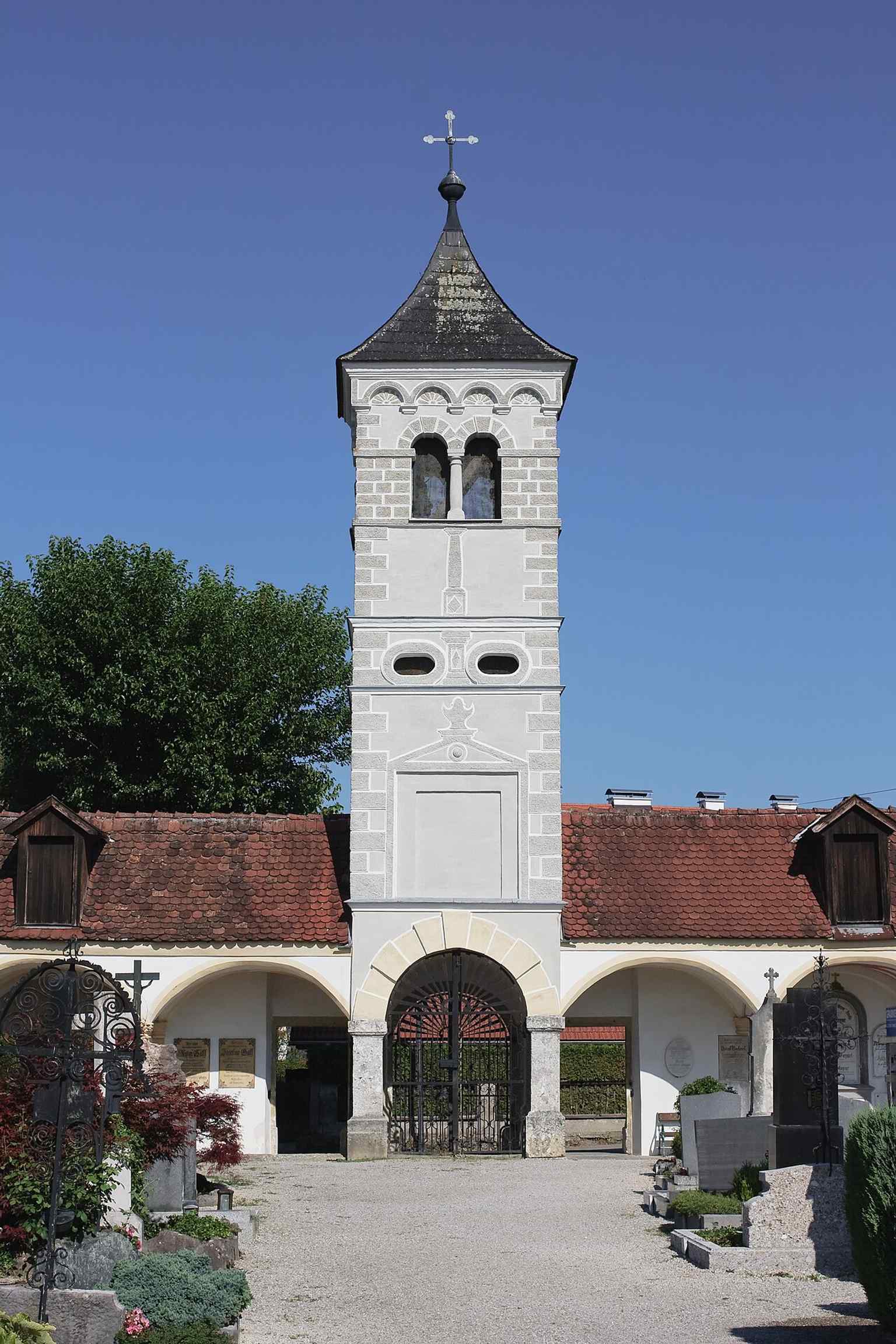 View from the arcades toward the entrance tower, highlighting the Campo Santo layout of the cemetery’s oldest section.