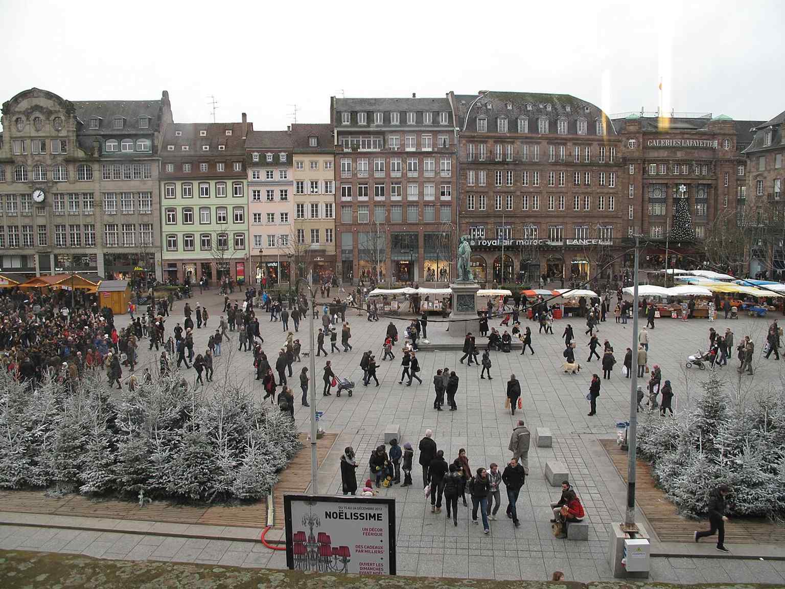 Seen from the Aubette, this image shows the square’s wide pedestrian layout after its modern reworking and tram integration.