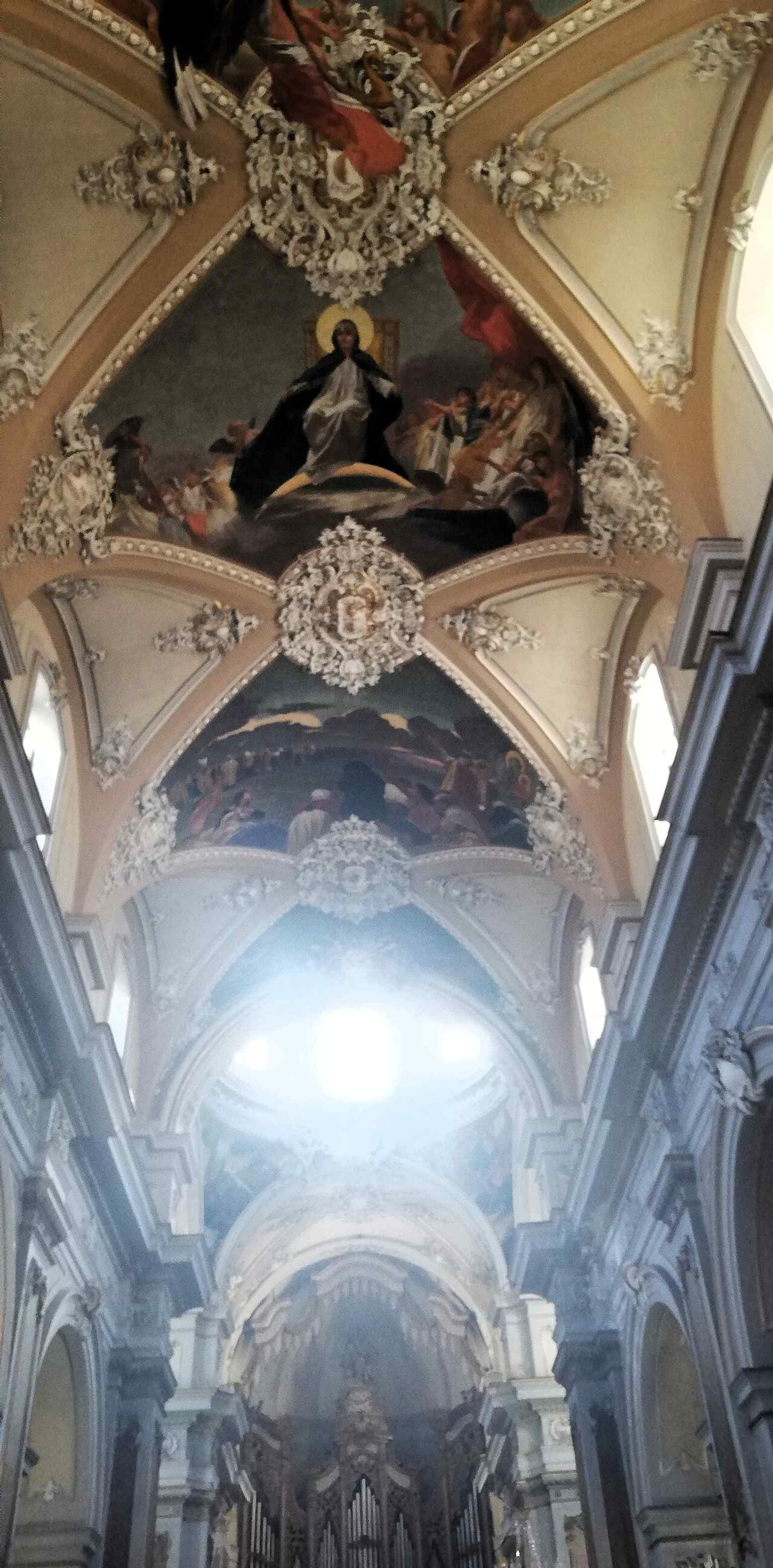One of the vault fresco views, recalling Giuseppe Sciuti’s late-19th-century cycle that fills the church with biblical scenes.