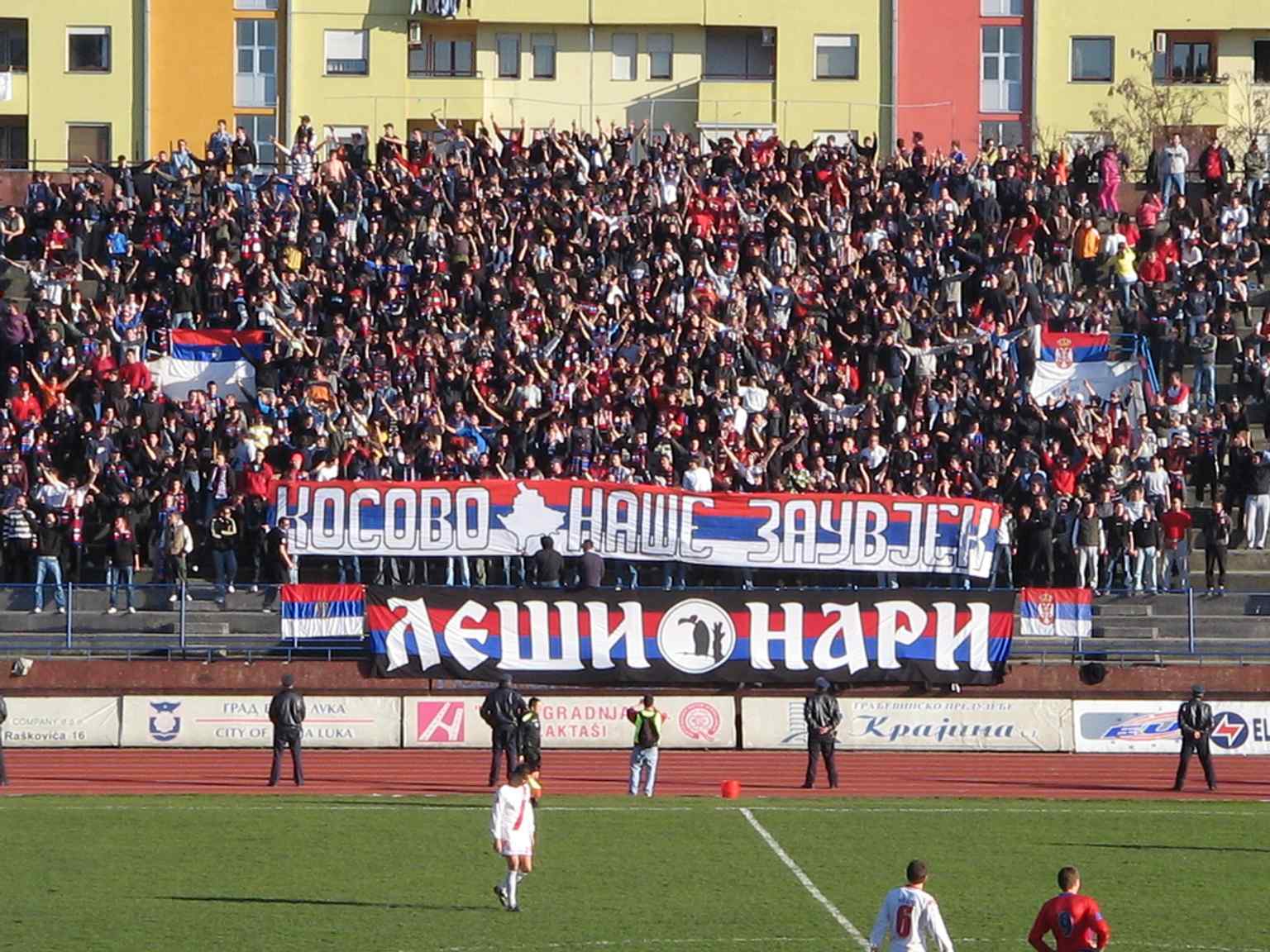 This image captures a football match in progress at the stadium, showcasing the energetic atmosphere generated by the loyal Lešinari fans.