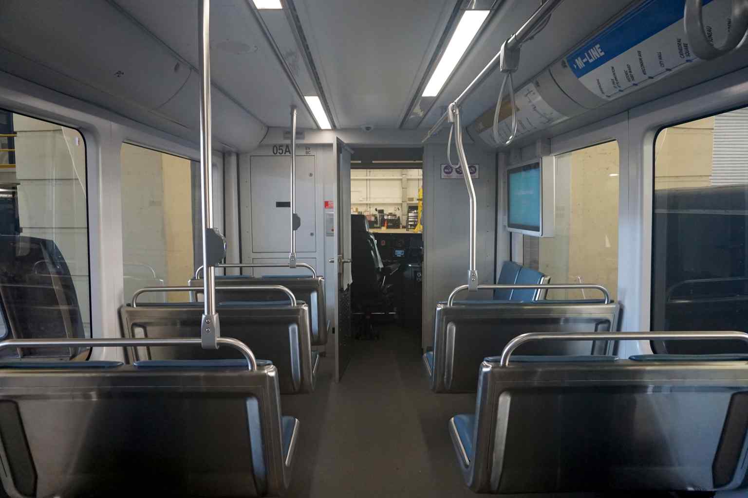 The accessible and modern interior of a Hop streetcar, designed to comfortably carry 120 to 150 passengers.
