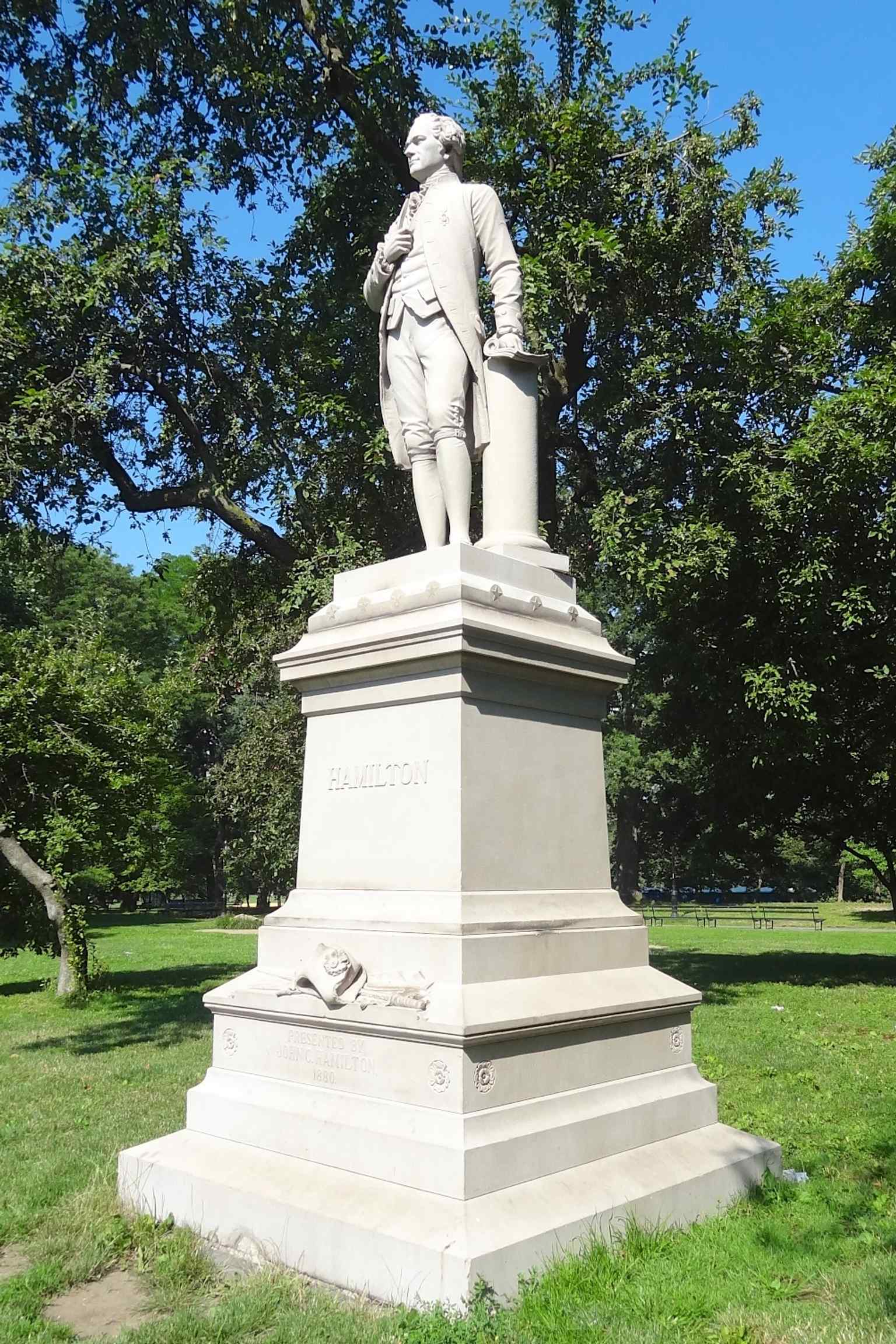 A clear view of Carl Conrads’s granite statue of Alexander Hamilton in Central Park, the memorial commissioned by Hamilton’s son and dedicated in 1880.