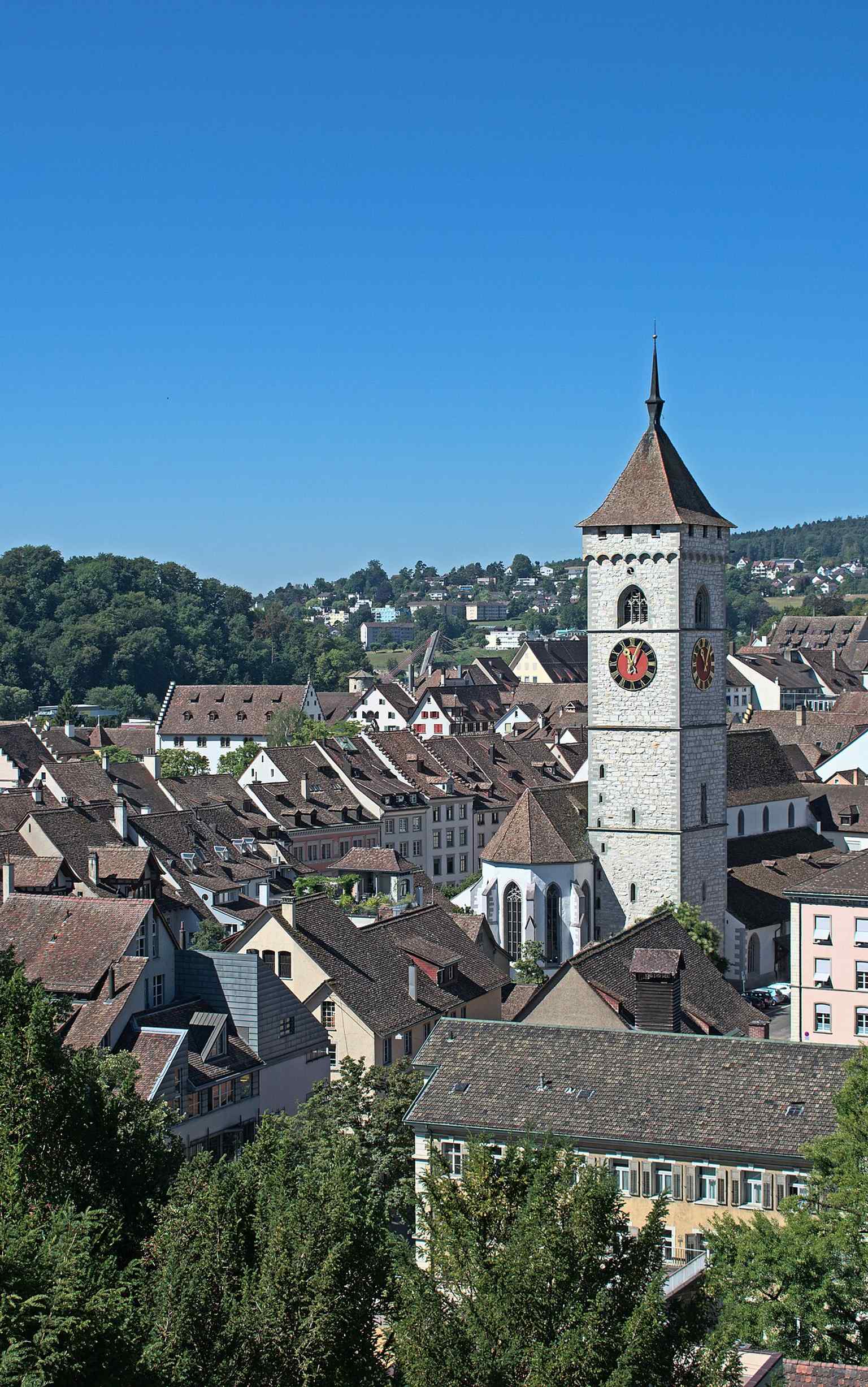 A high, sweeping view with St. Johann at the center, showing the church's urban setting in Schaffhausen.