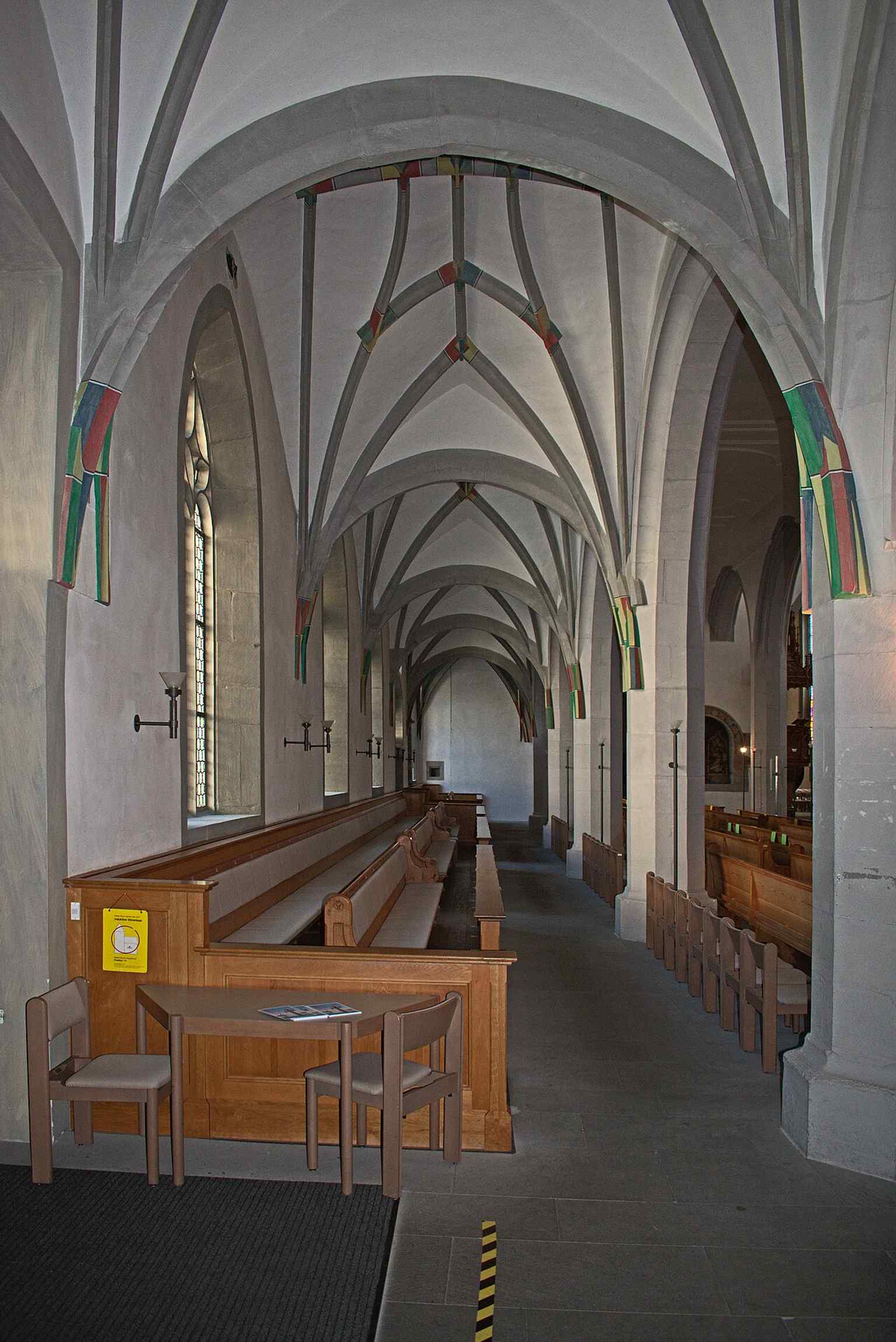 The side nave interior highlights the church’s spacious Gothic hall, later adapted for worship and concerts.