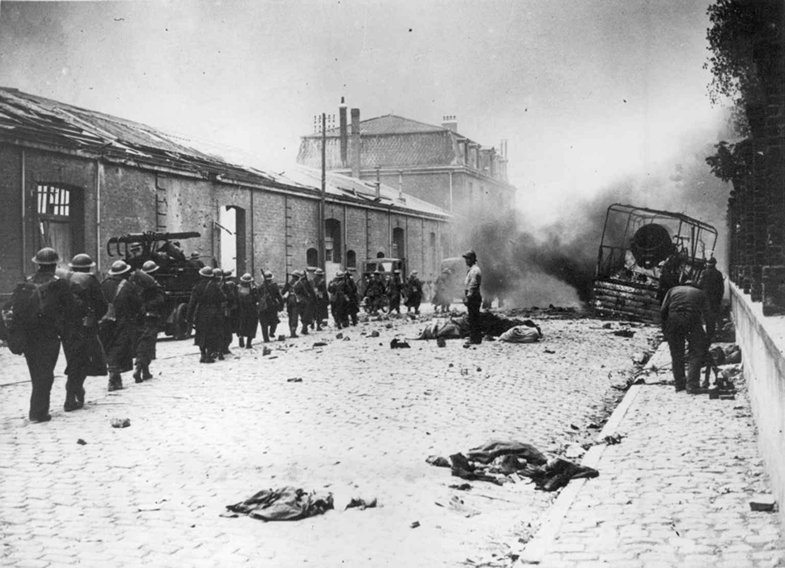 German bombardment over Dunkirk in 1940, showing the city under the Luftwaffe attacks that made the evacuation so desperate.