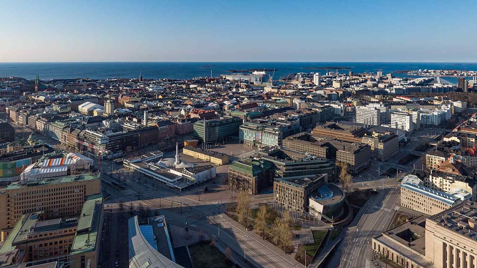 Aerial view over central Helsinki near Mannerheimintie, helping place Postitalo in its urban setting by Mannerheiminaukio and the surrounding civic core.