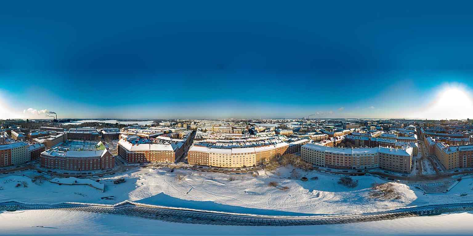 A wide 360° winter panorama of the church site, showing how the building sits within the rocky Etu-Töölö setting it was designed to preserve.