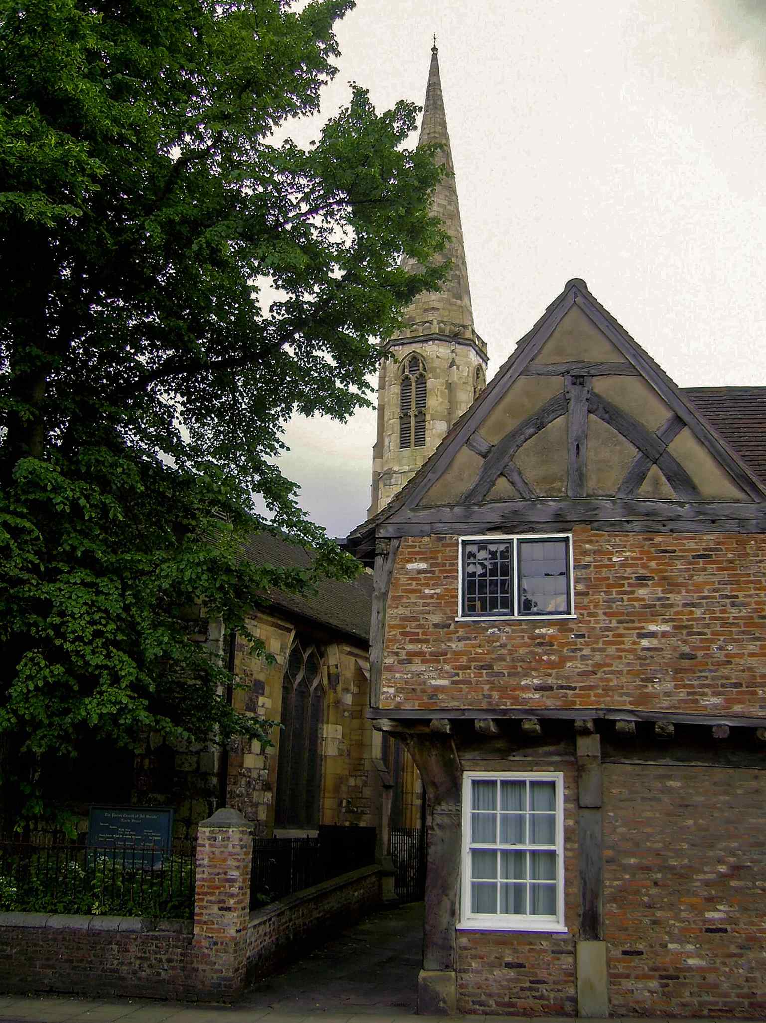 An overall view of All Saints Church, useful for introducing the Grade I listed building and its setting on North Street.