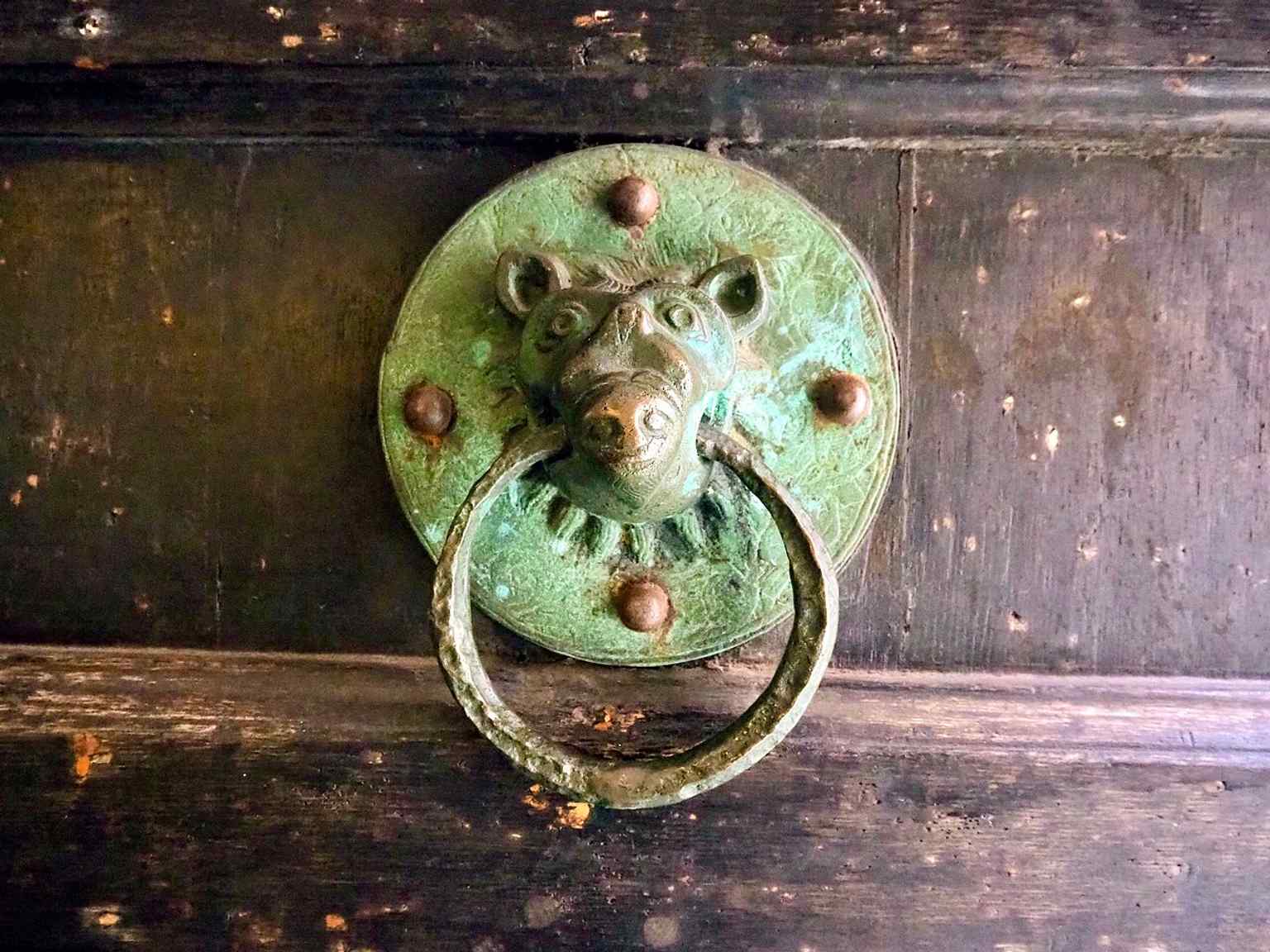 A close detail of the church’s entrance hardware, part of the fabric of the medieval building still in use.