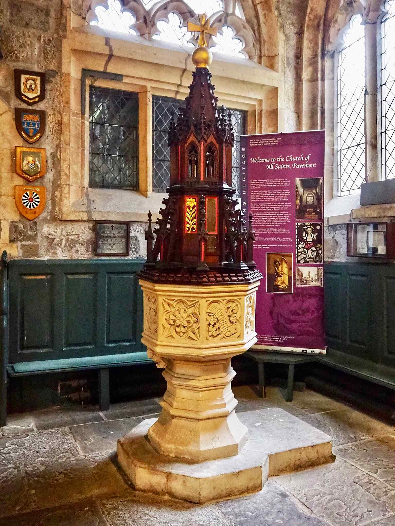 The font, a reminder of the church’s long sacramental life and centuries of parish use.