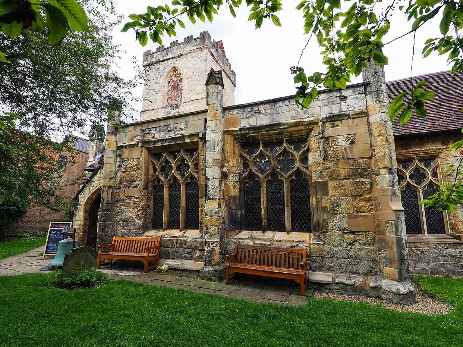 Another modern exterior angle that emphasizes the church’s medieval massing and later repairs in brick and stone.