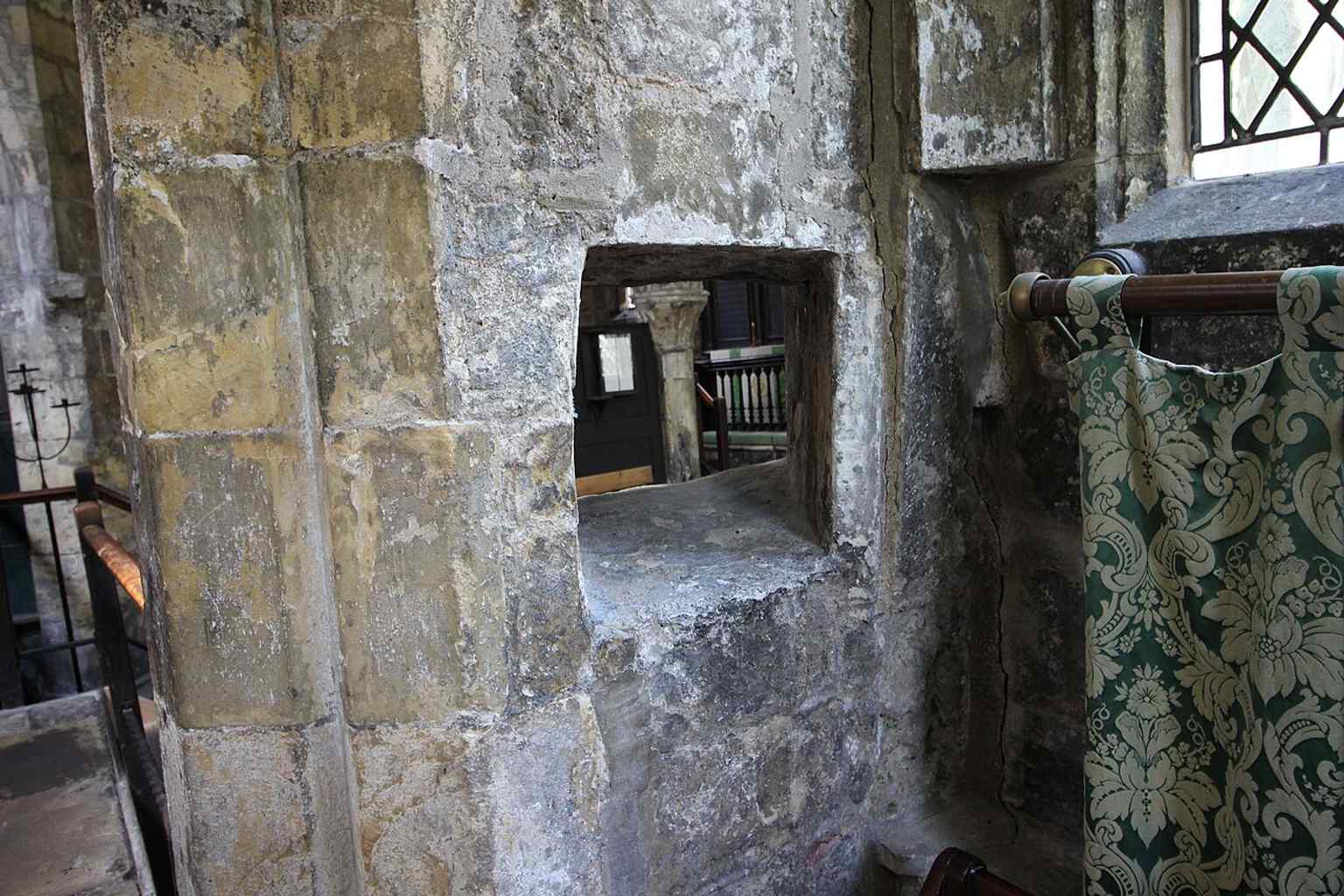The hagioscope, or squint, that let lepers follow services from the side chapel while remaining apart from the main congregation.
