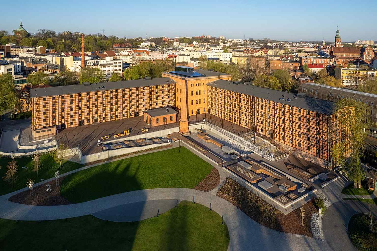 A wide aerial view of Rother’s Mills from Mill Island, showing the central industrial heart of the island on the Brda river.