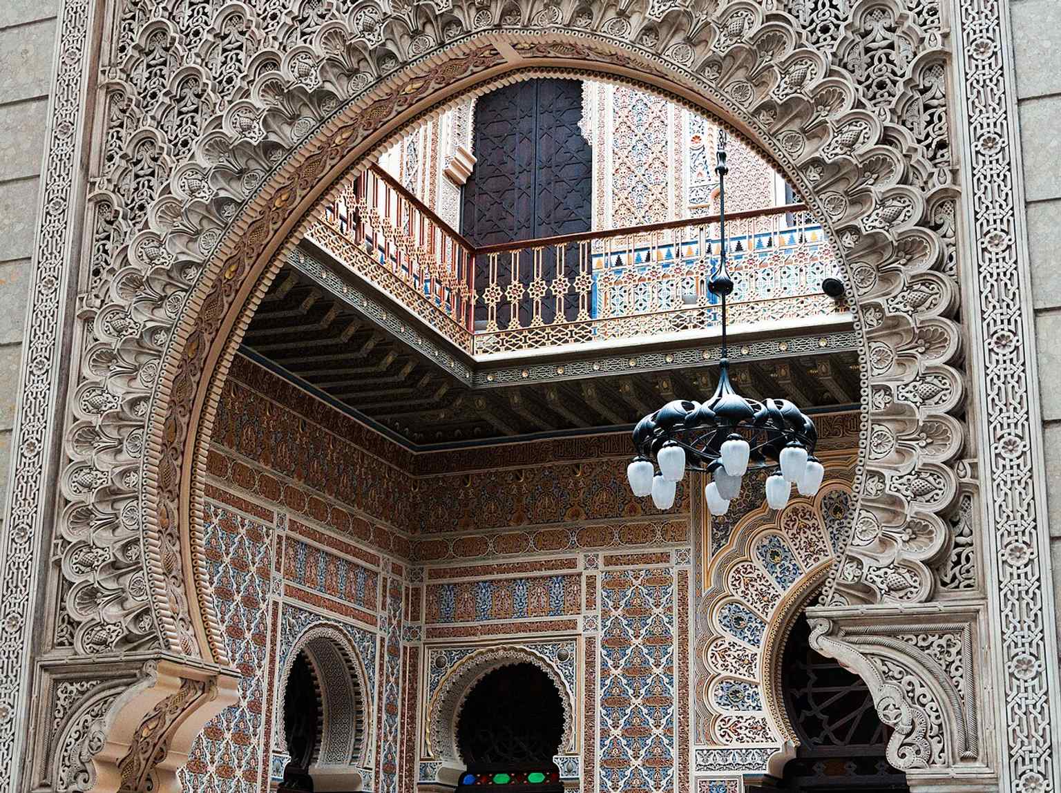 An intricate Arabic archway within Murcia's famed Casino, renowned for its sumptuous interiors and diverse architectural styles.