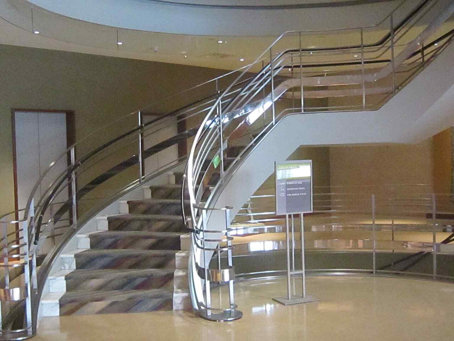 The museum’s signature spiral staircase, preserved from the former Barneys building, became the centerpiece of the six-story gallery tower.