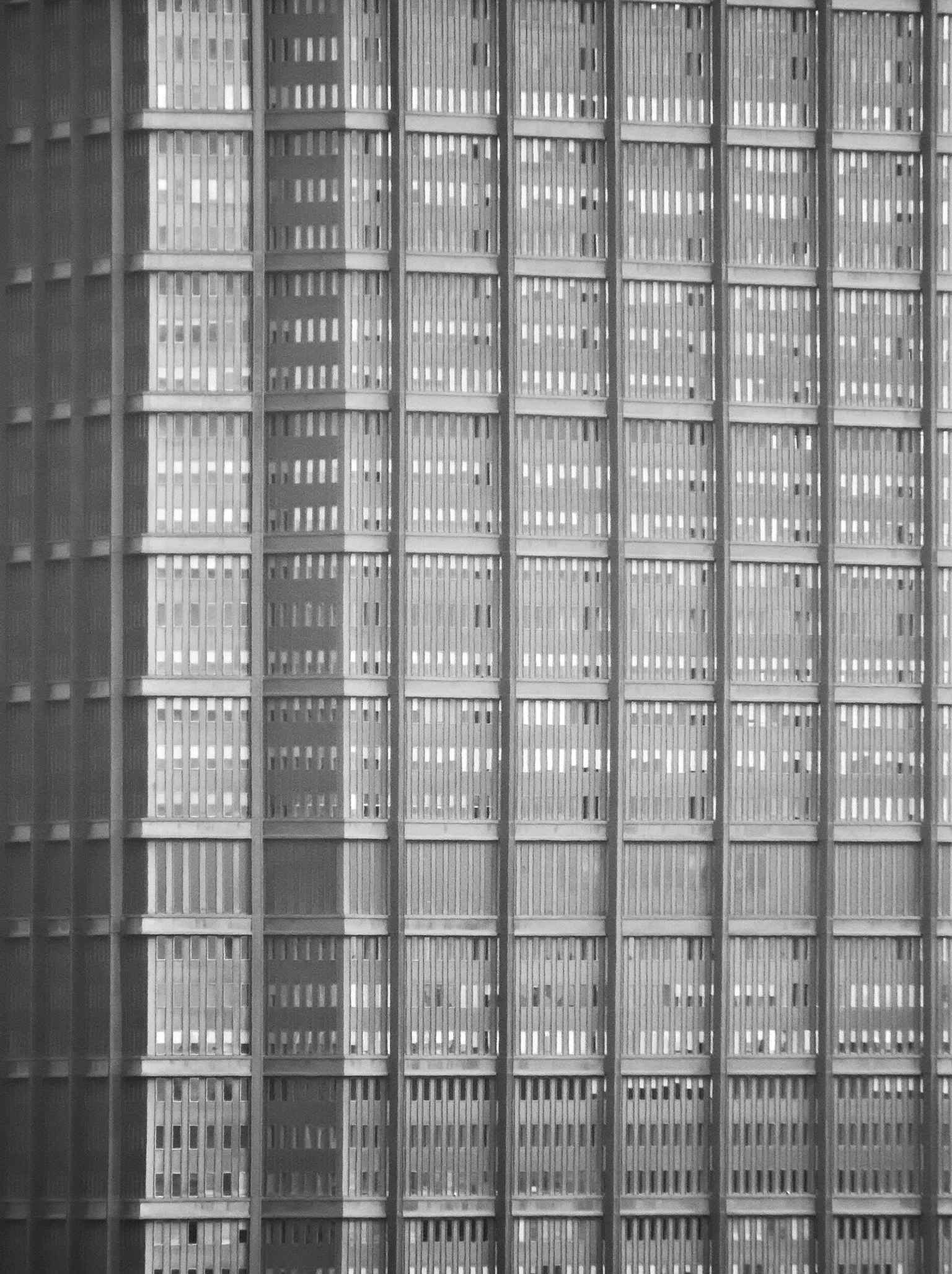 A close look at the U.S. Steel Tower reveals its unique triangular shape with indented corners and the distinctive Cor-ten steel, which forms a protective dark brown oxidation layer against weather.