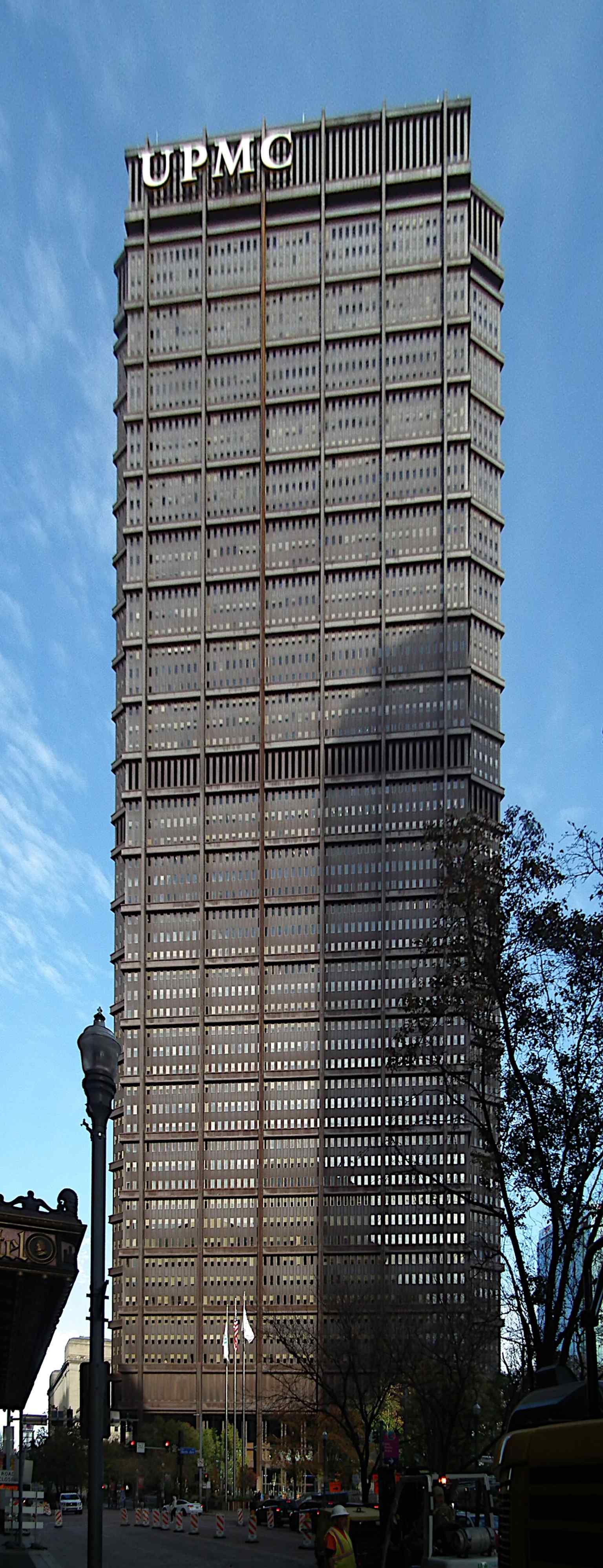 The towering U.S. Steel Tower dominates Grant Street in downtown Pittsburgh, reflecting its colossal presence and status as a beacon of the city.