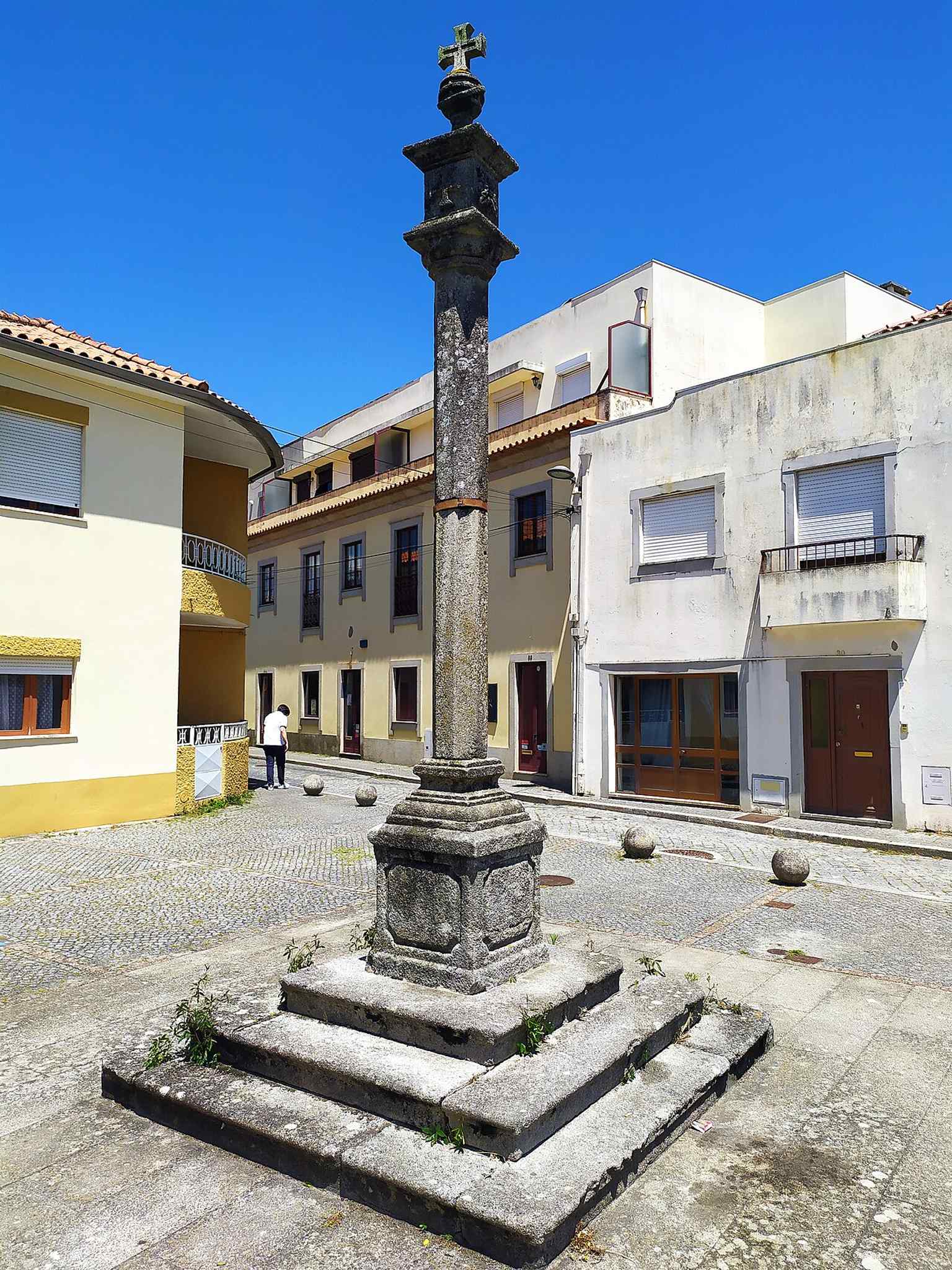 Another view of the old civic monument near the chapel, adding local heritage context to the walking tour route.