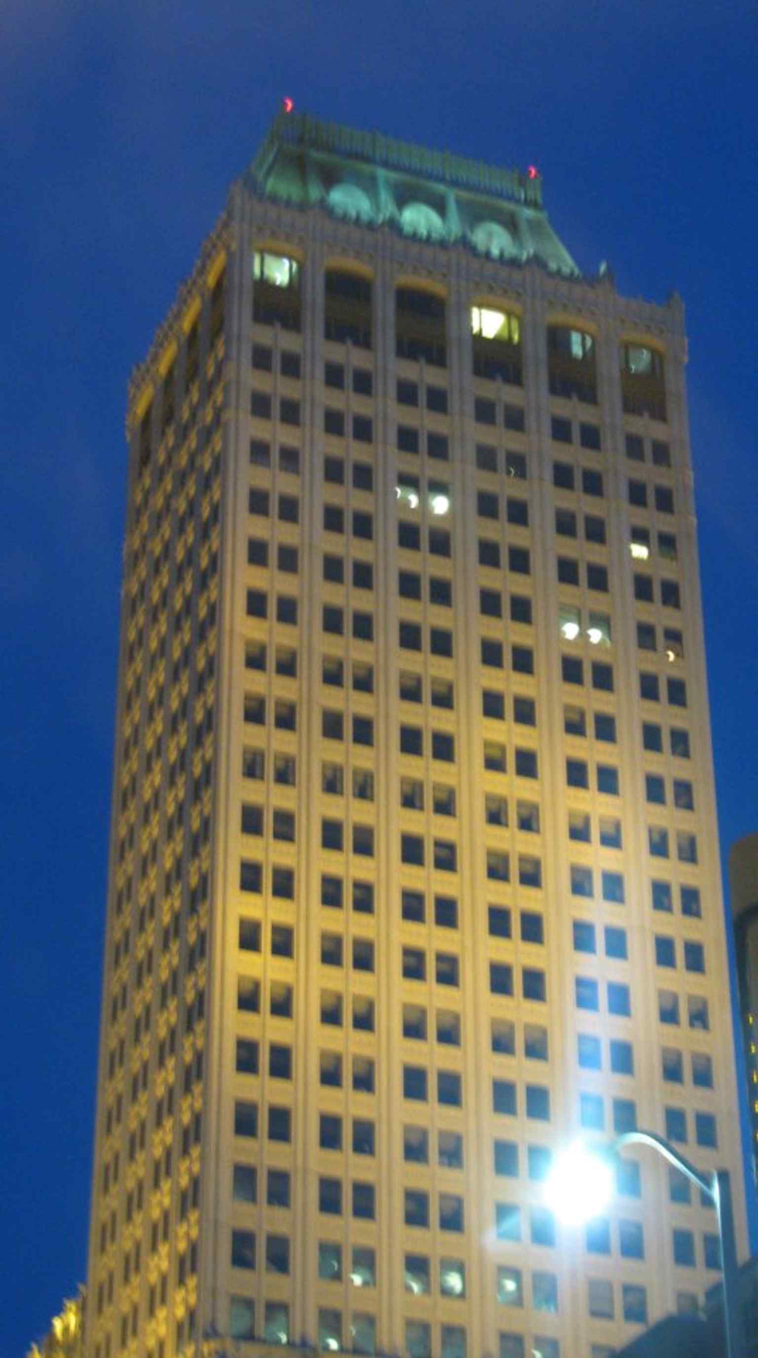 View of the original 16-story Cosden Building, built in 1918 for oil baron Joshua Cosden, whose grand vision was inspired by New York City's Woolworth Building and its Tudor Gothic grace.