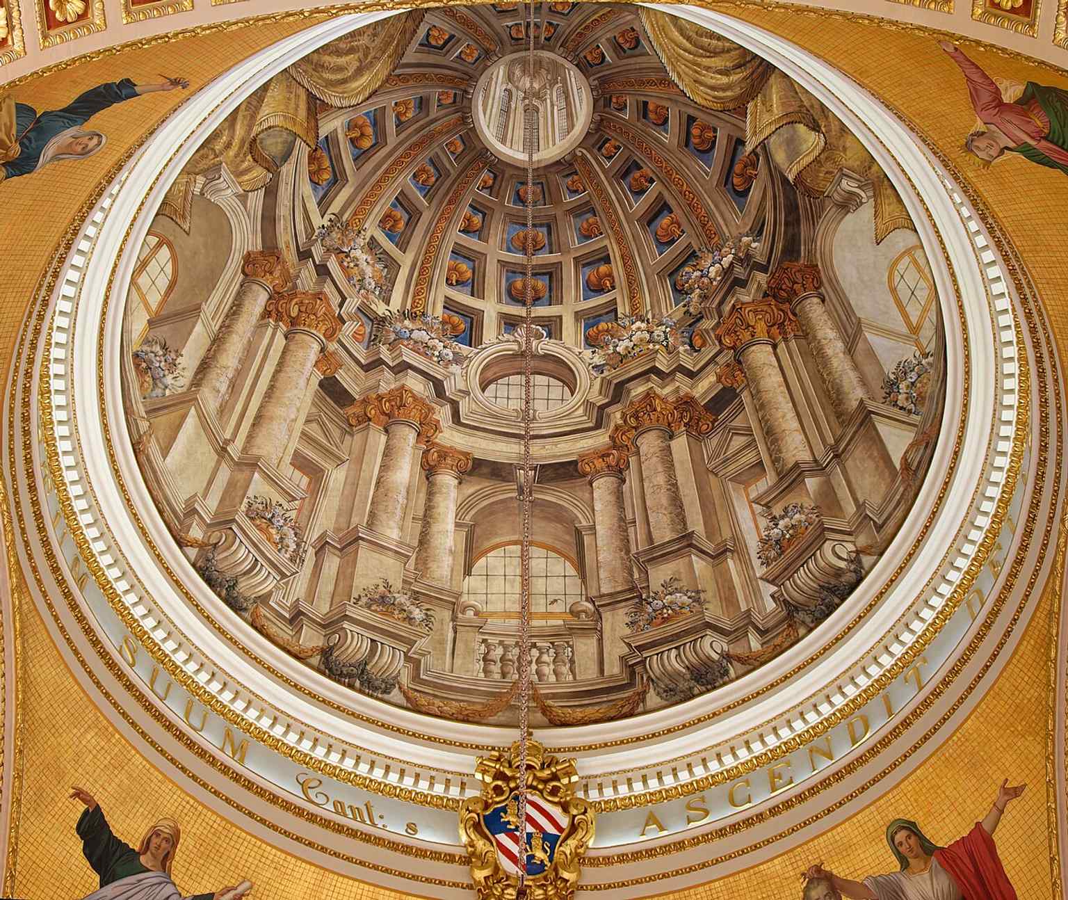 The interior artwork and lighting emphasize the cathedral’s theatrical Baroque finish, completed as a visual counterpart to its liturgical role.