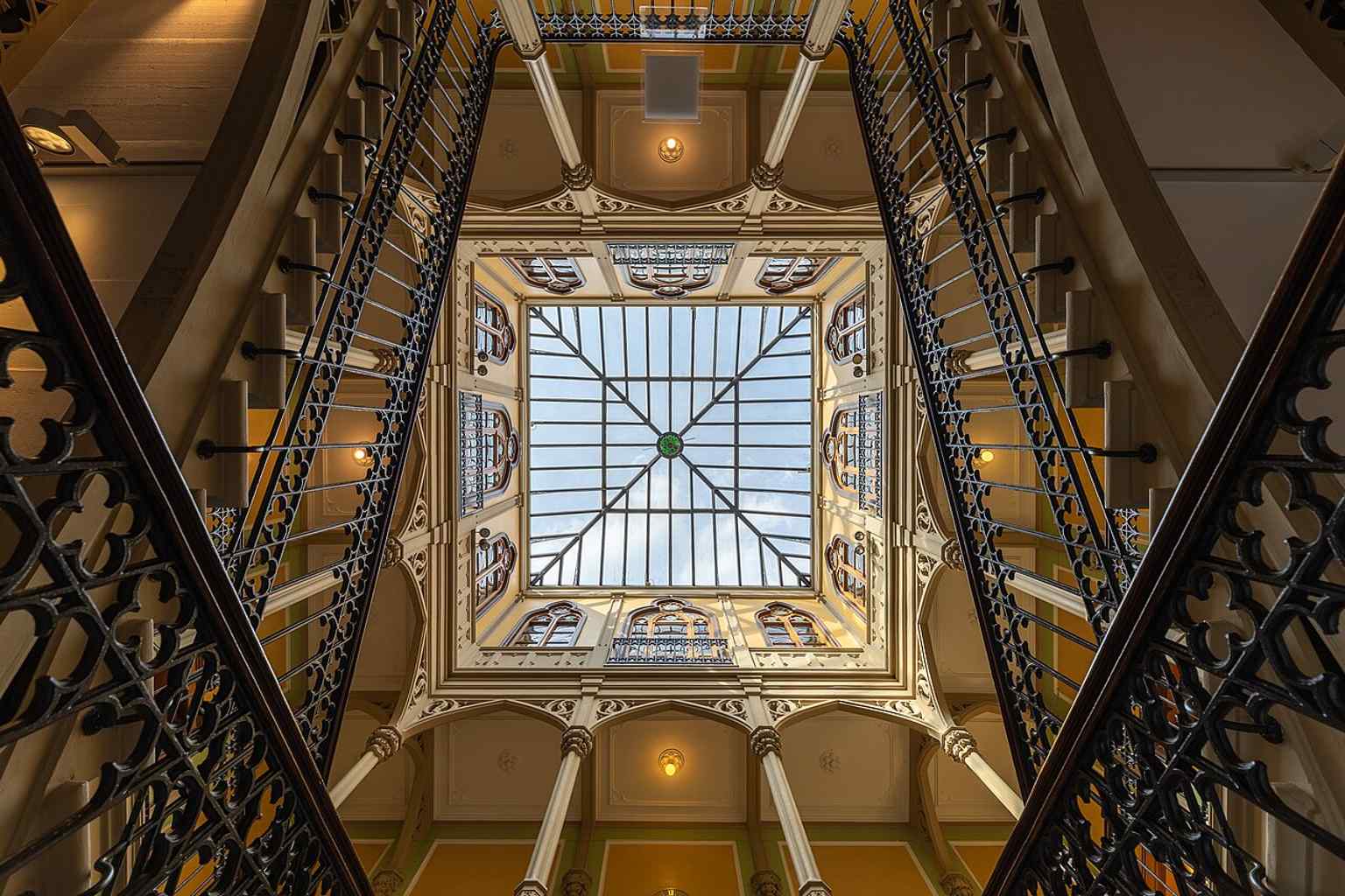 The stairwell and skylight inside Colombischlössle, highlighting the grand interior features that reflected the builder’s wealth.