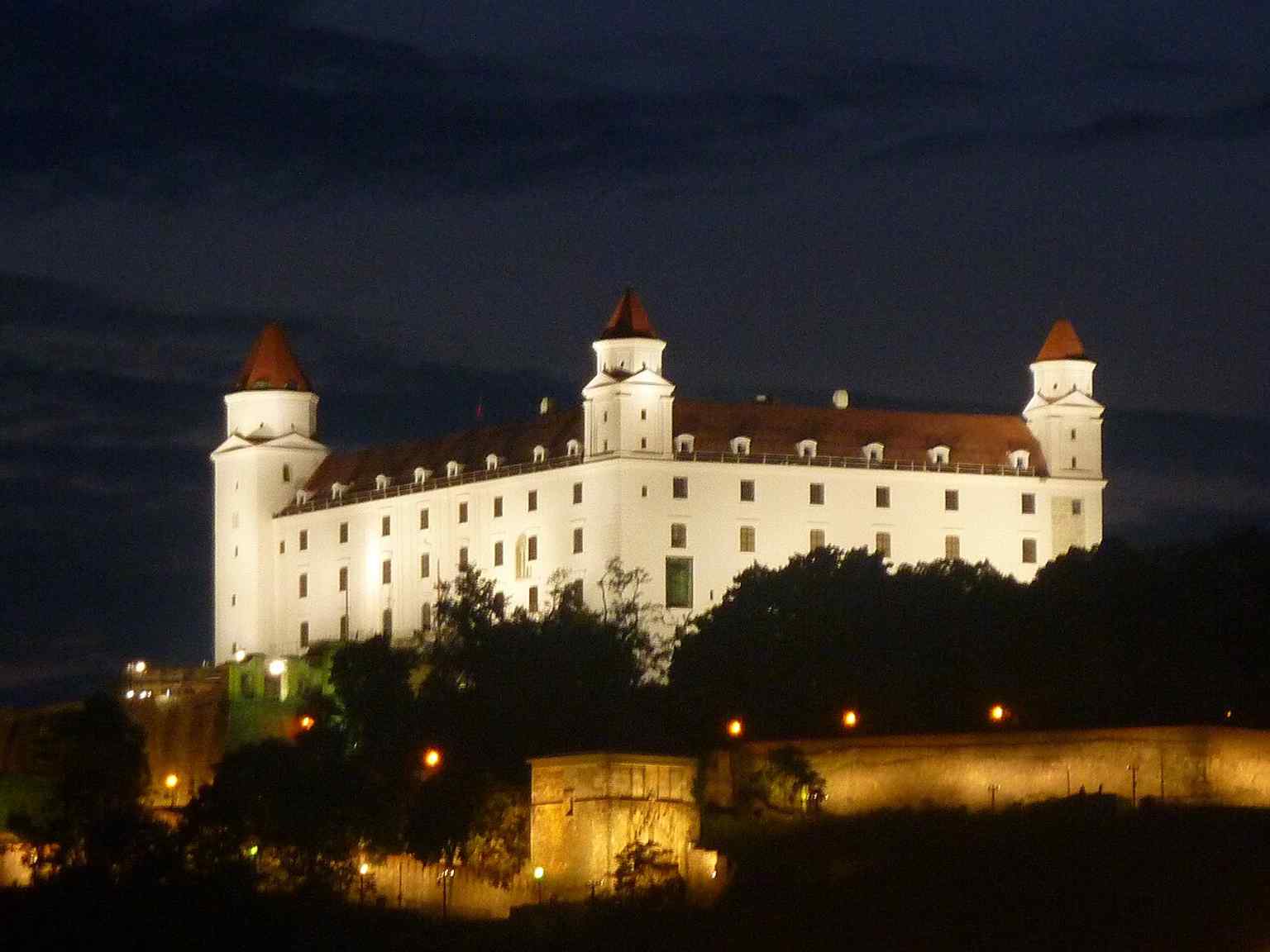 Bratislava Castle by night, a striking panorama of the landmark that still defines the skyline above the Danube.
