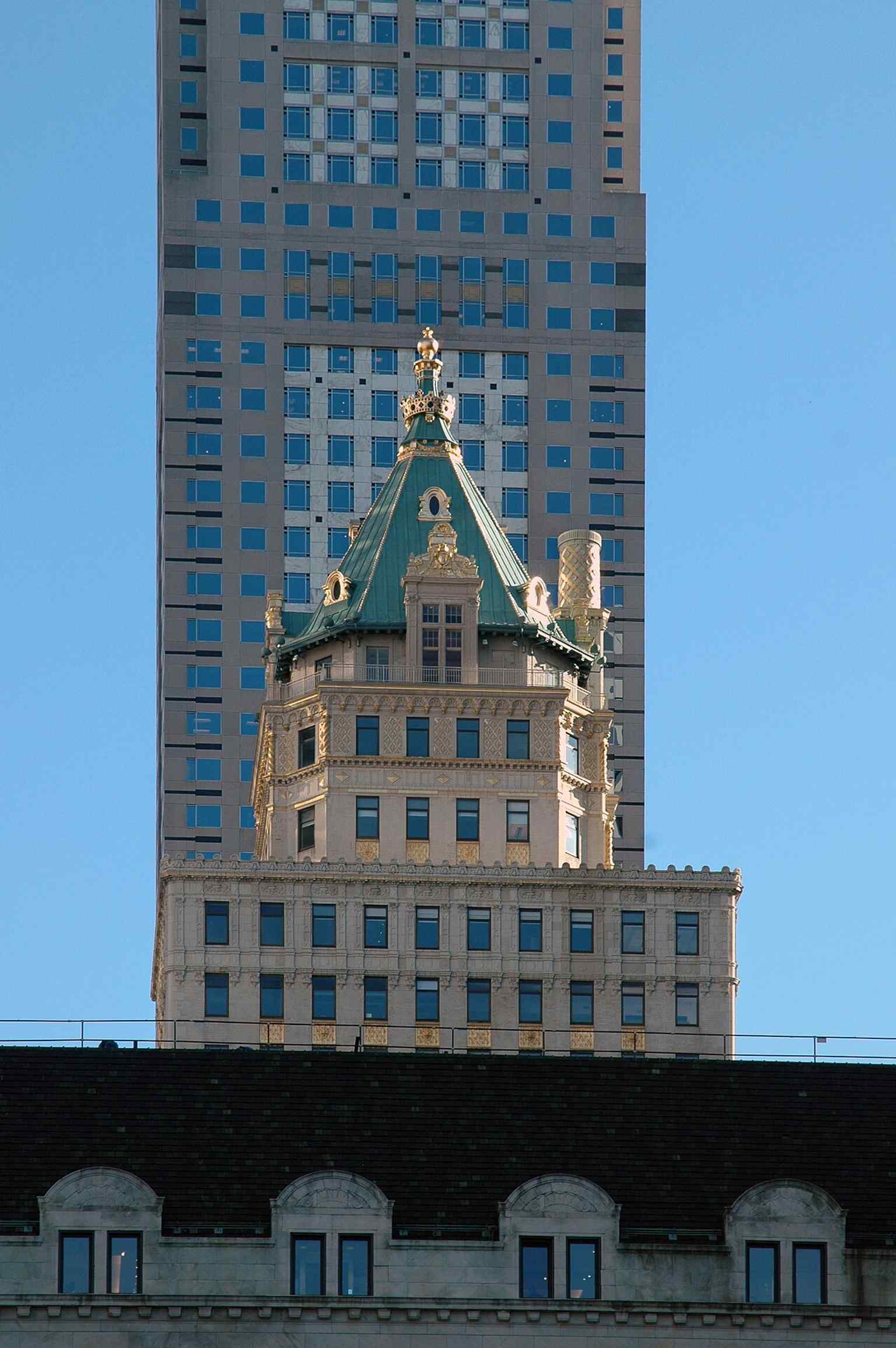 The Crown Building’s gilded crown rising above Fifth Avenue — the roofline made it a standout on the Midtown skyline before the Aman conversion.