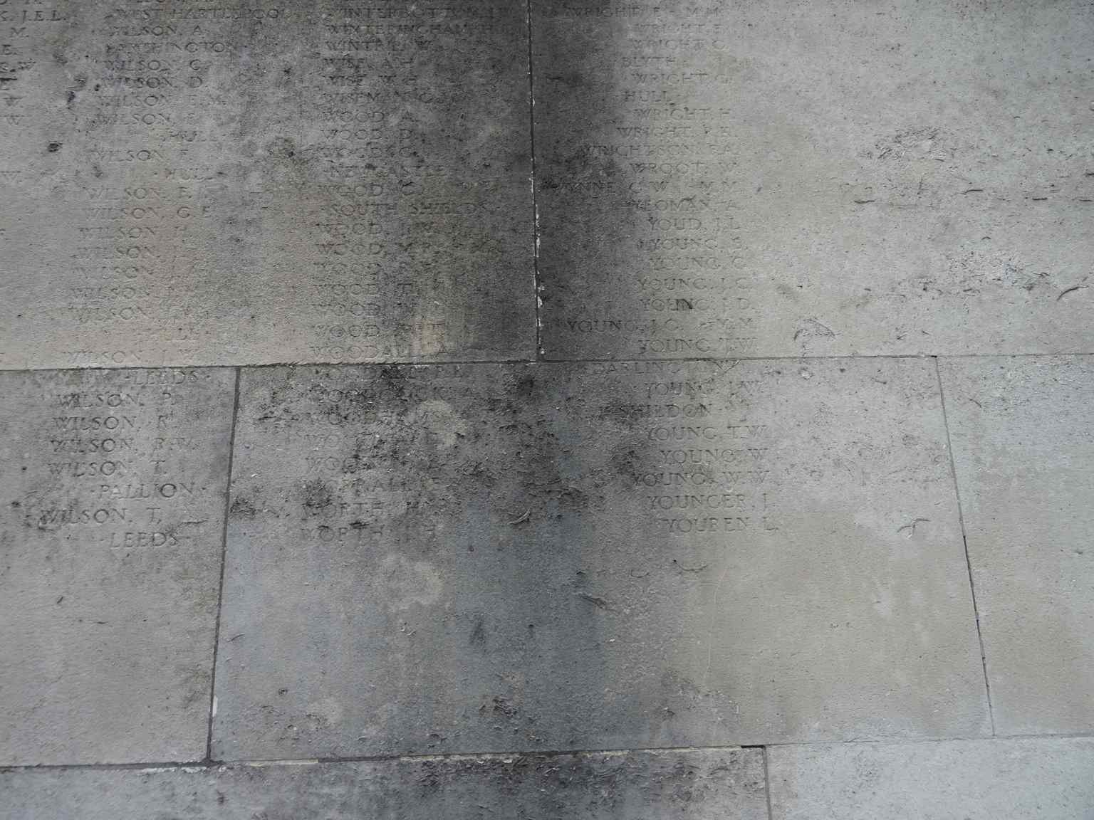 Time and the elements have softened the original inscriptions carved into the delicate Portland limestone panels, showing the natural weathering of the monument (2017).