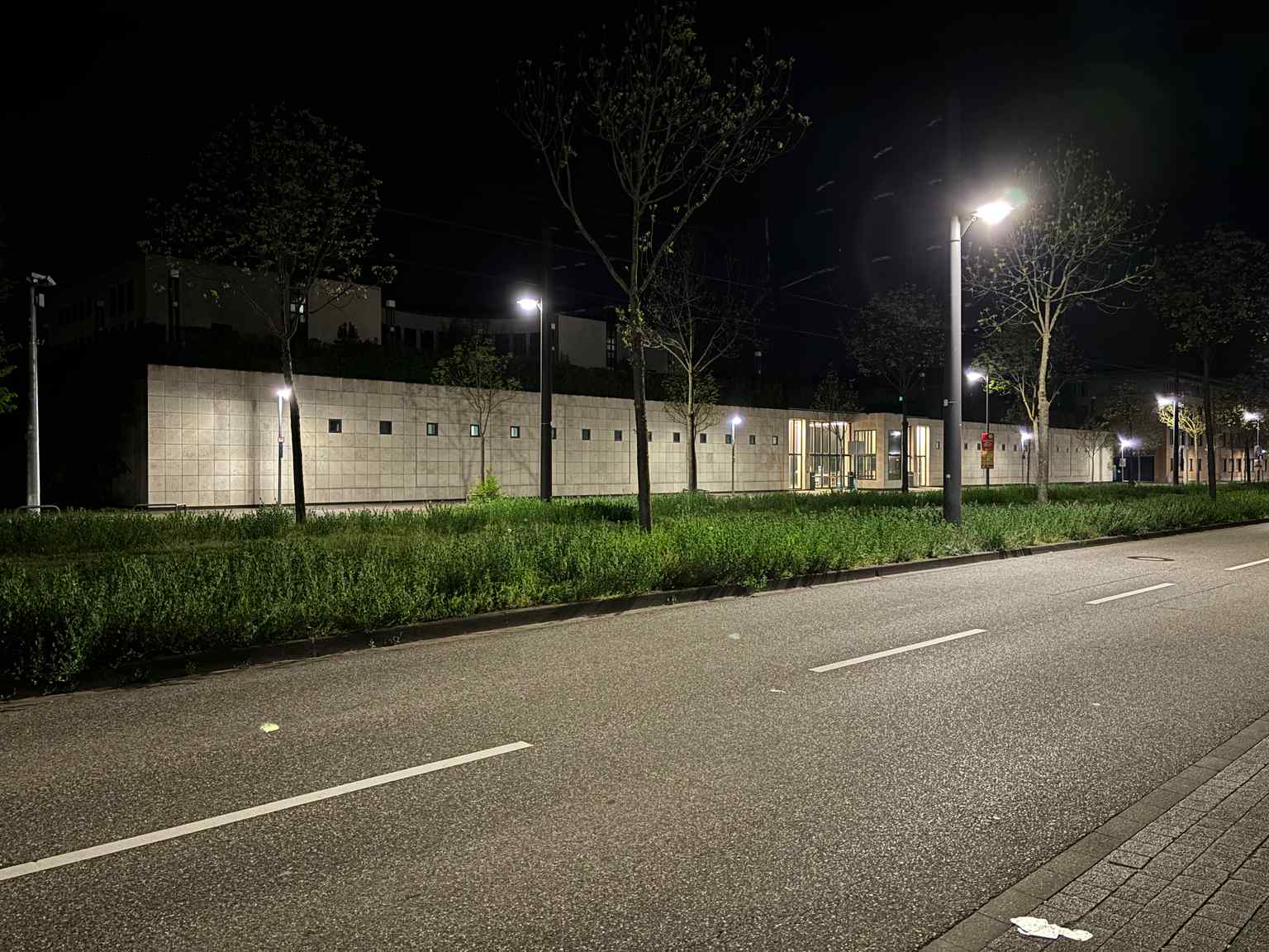 The main seat of the Federal Prosecutor General in Karlsruhe, pictured here at night, is a modern 'Stadtpalais' designed by Oswald Mathias Ungers and occupied in 1998. It is specifically mentioned as being enclosed by a five-meter-high security wall.