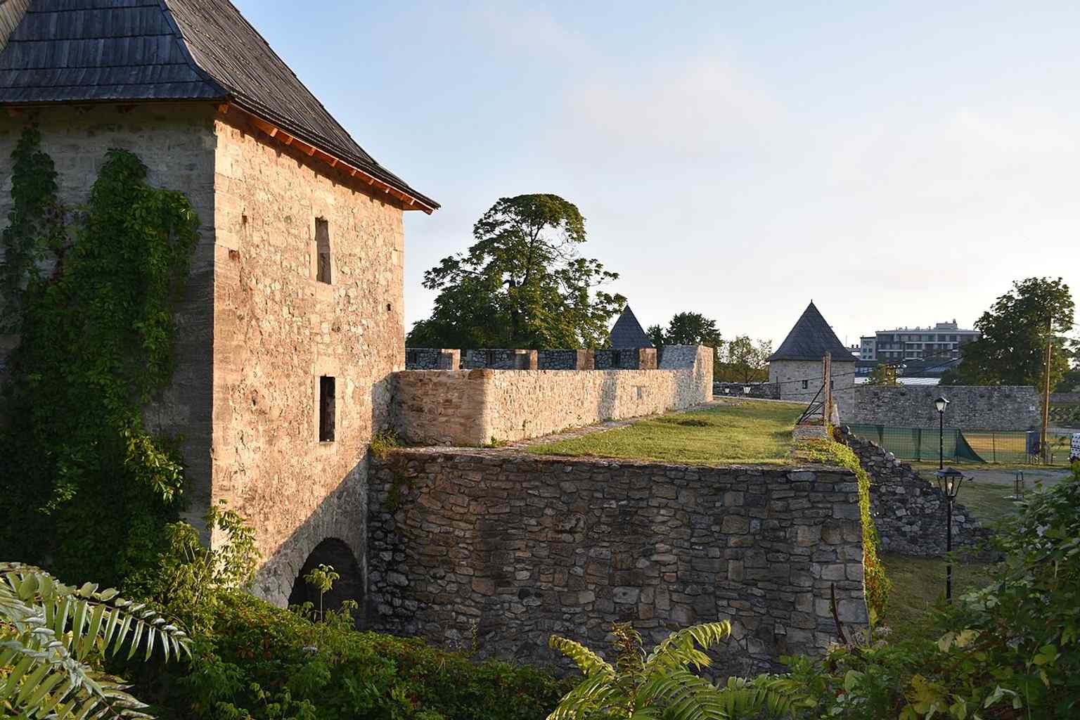 An interior view of the open space within the fortress, showing remnants of structures and evoking its continuous use for military and other purposes until 1959.