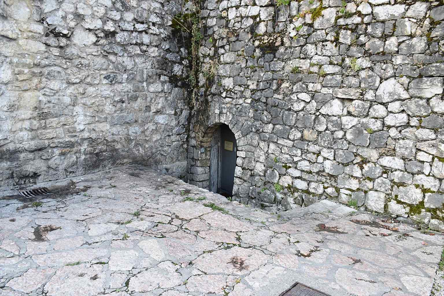 A closer look at one of the three tucked-in rectangular towers, part of the fortress's defensive system and architectural design.