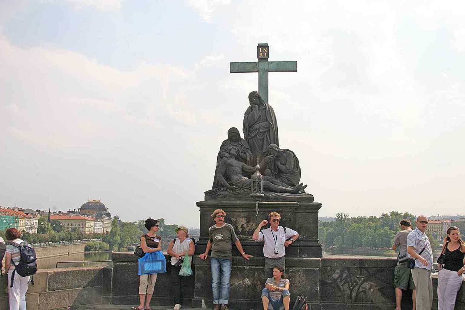 The Pietà stands on the south side of the Charles Bridge, marking the third pillar—a spot that has held religious markers since a wooden crucifix was destroyed by a catastrophic flood in 1496.