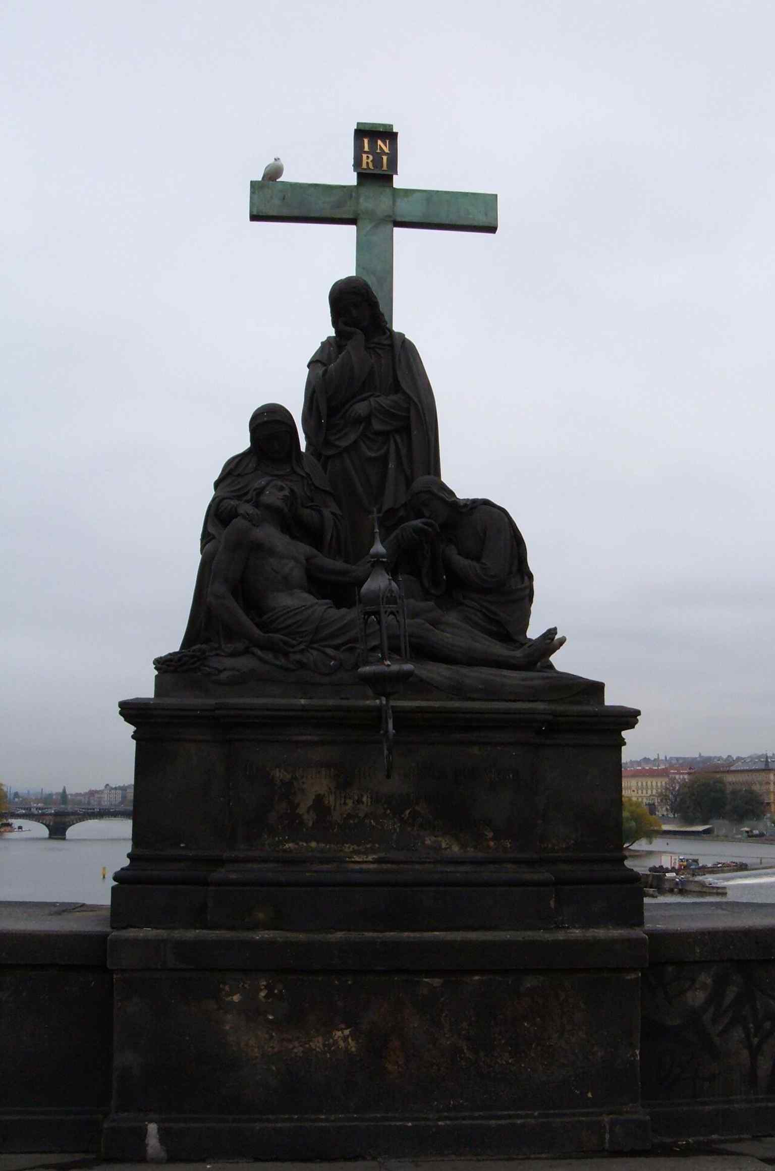 A detailed view captures the emotional depth of the sculpture, portraying the profound grief of the Virgin Mary holding the deceased Christ.