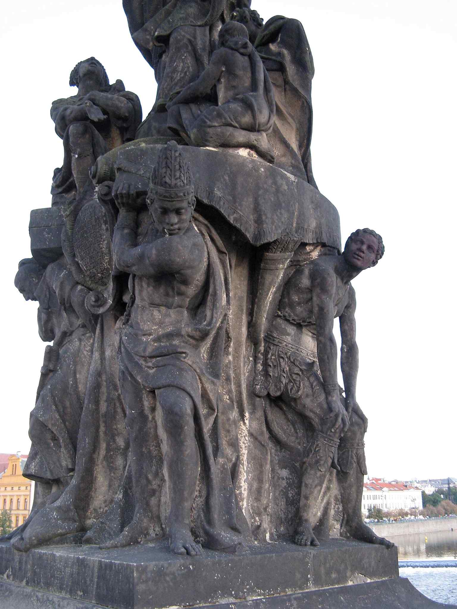 The replica of the statue on Charles Bridge, noted for its ambitious scale as the entire central group is held aloft by figures representing regions where Xavier preached.