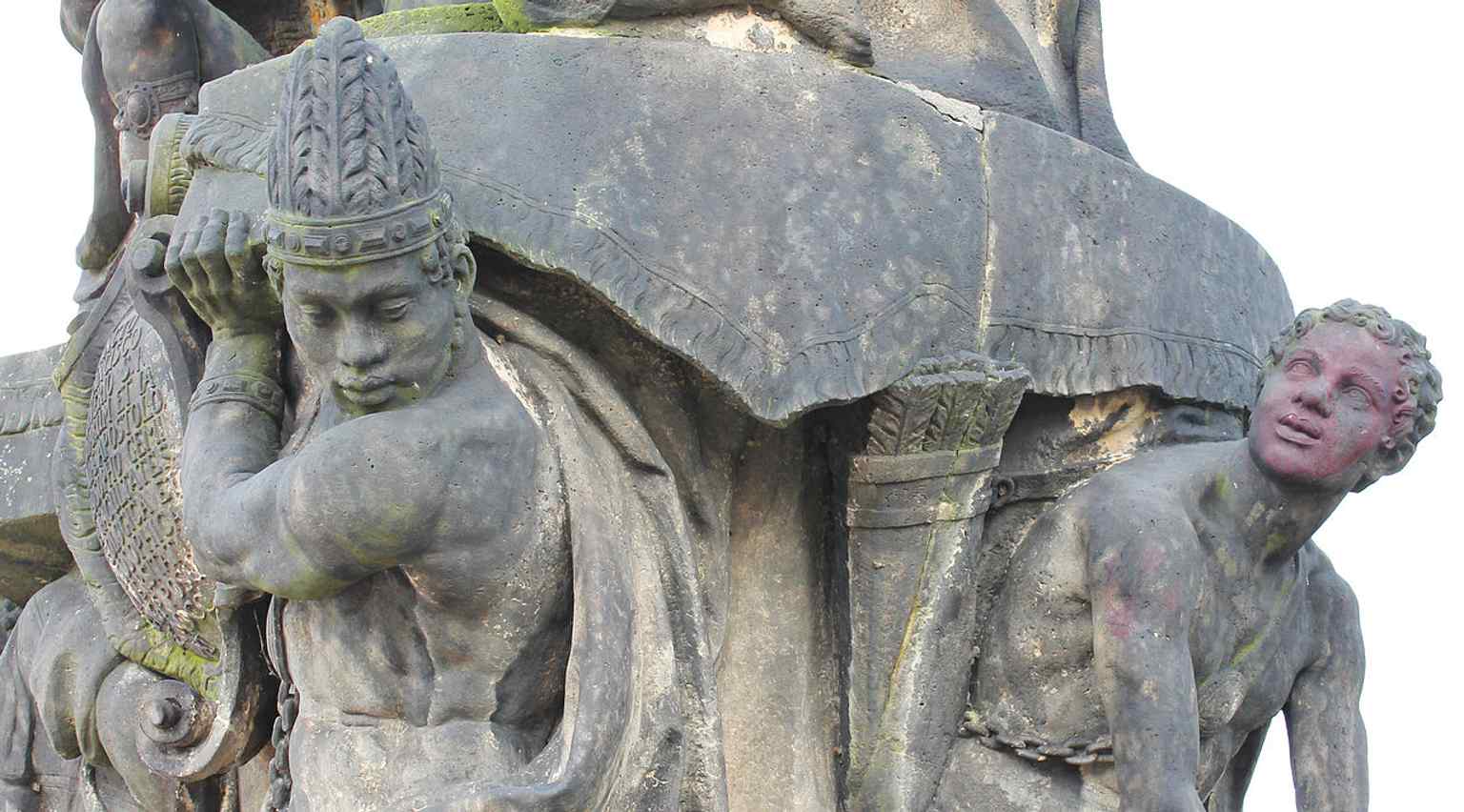 One of the diverse figures at the base of the statue, representing a Moor, symbolizing one of the 'four corners of the world' reached by Saint Xavier's missions.