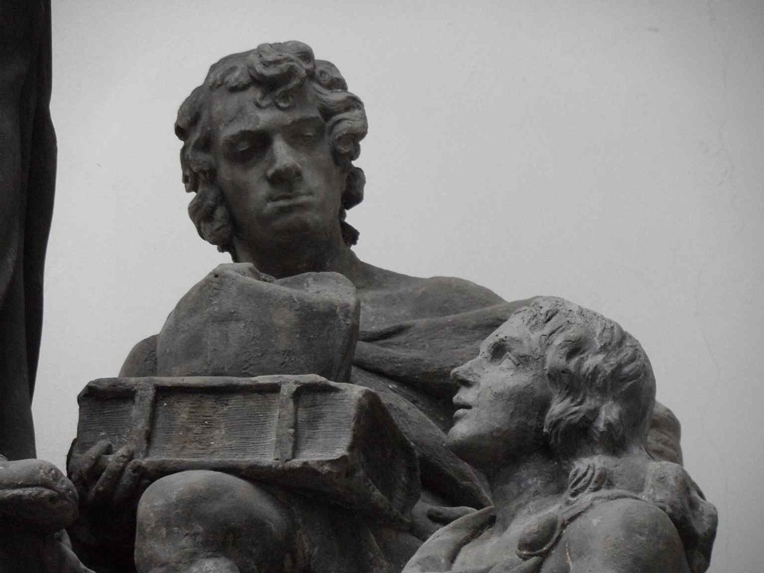 The notable fragment of the original statue containing Brokoff’s self-portrait (the head of the young man), which was reportedly kept for a time by sculptor Josef Václav Myslbek.