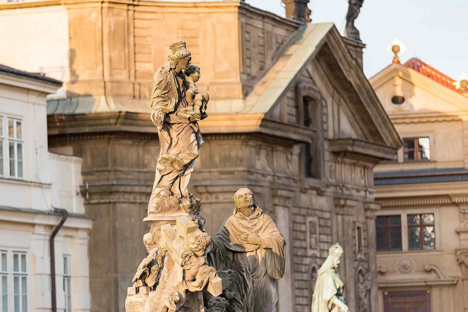 The left side of the statuary, dedicated to the 'Arma Christi,' features a large cross and the 'Veraikon' or Veil of Veronica.