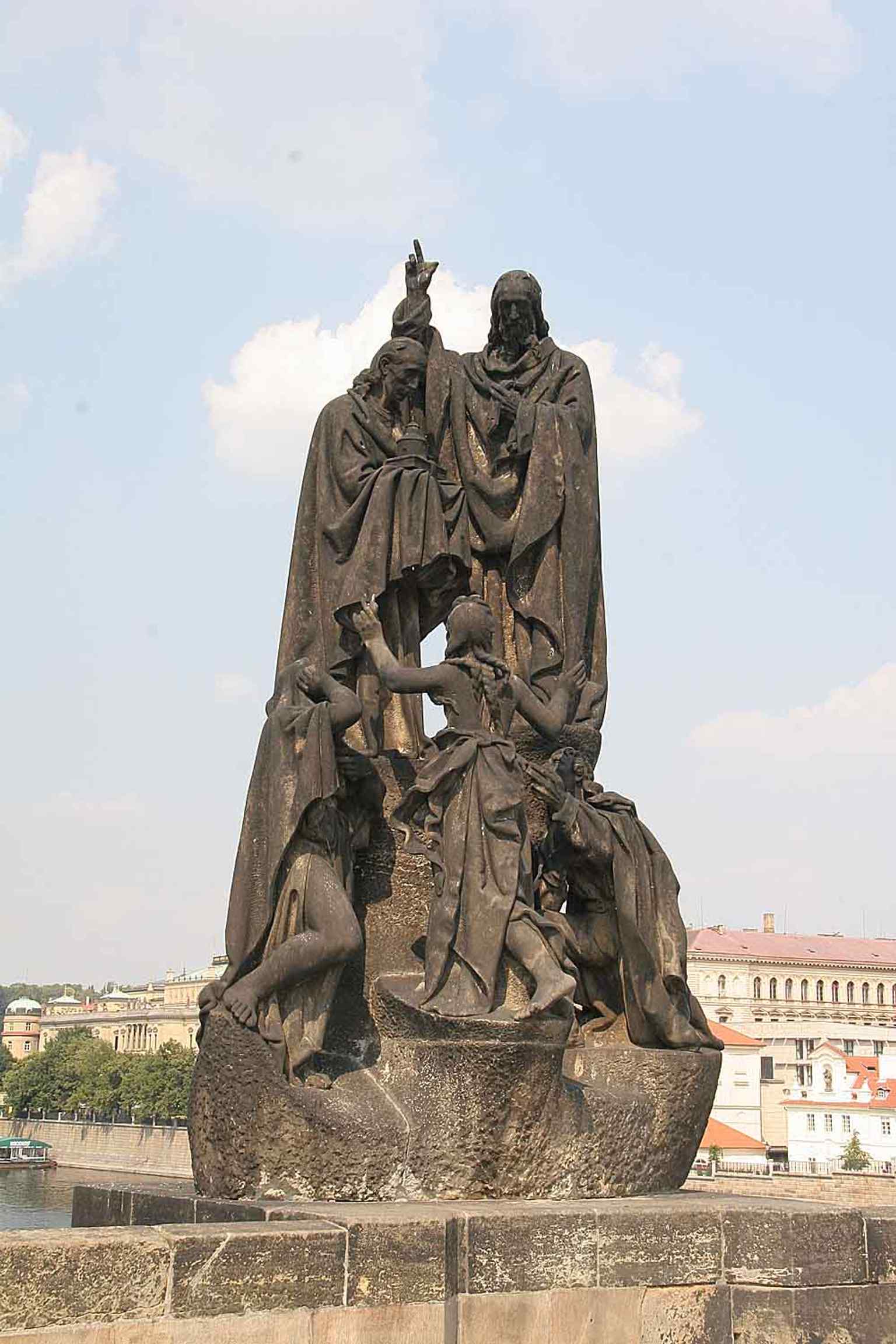 This sculpture replaced a Baroque statue of Saint Ignatius of Loyola, which was tragically lost along with parts of the bridge during the catastrophic 1890 Vltava River flood.