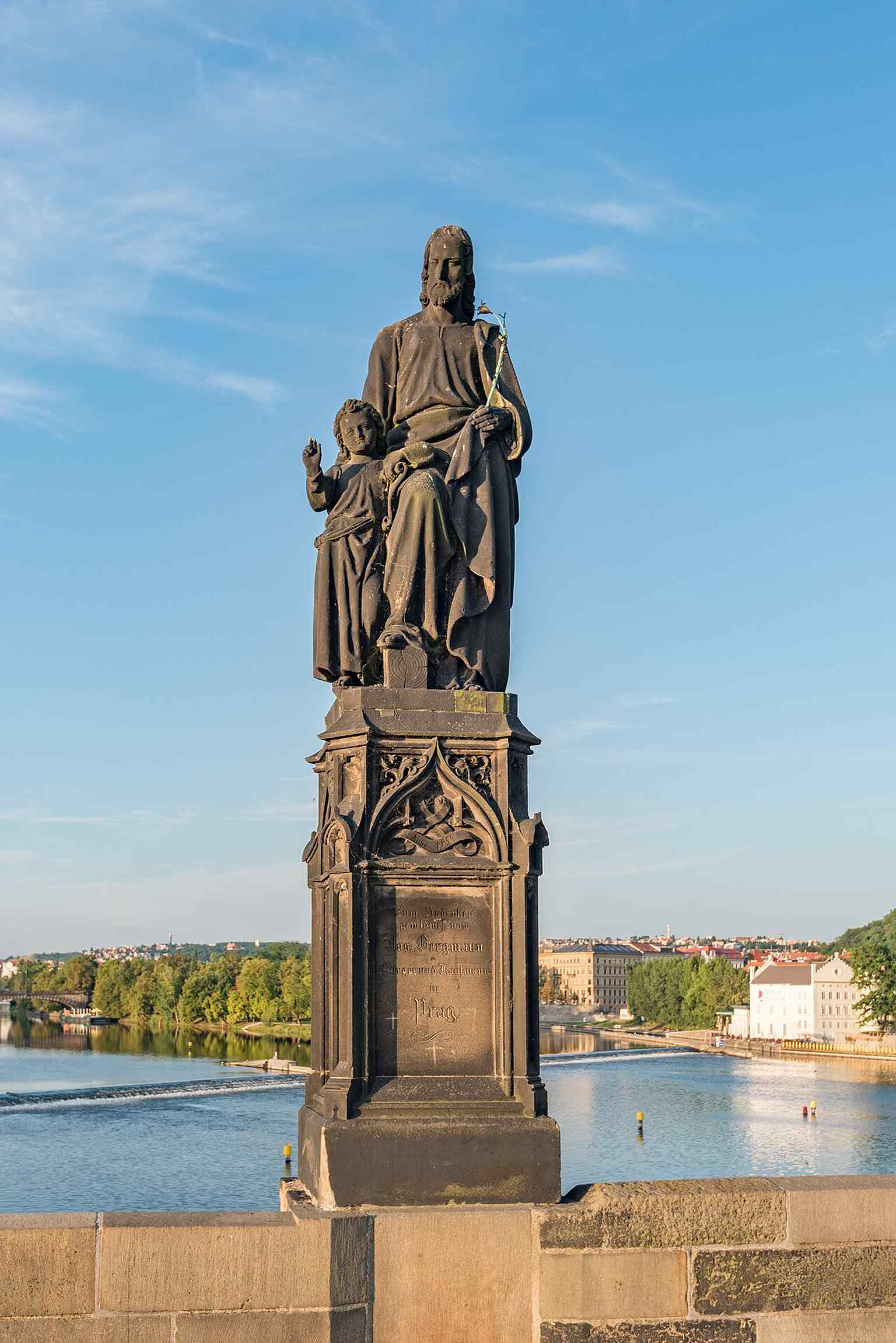 The current 19th-century sculpture by Josef Max depicts Saint Joseph tenderly leading the young Jesus by the hand, a motif retained from the original Baroque work.