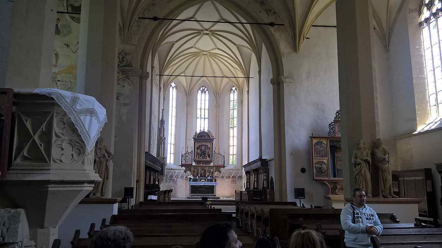 Within the nave, explore the solemn row of 60 sarcophagi, part of the unique historical context of this Transylvanian church.