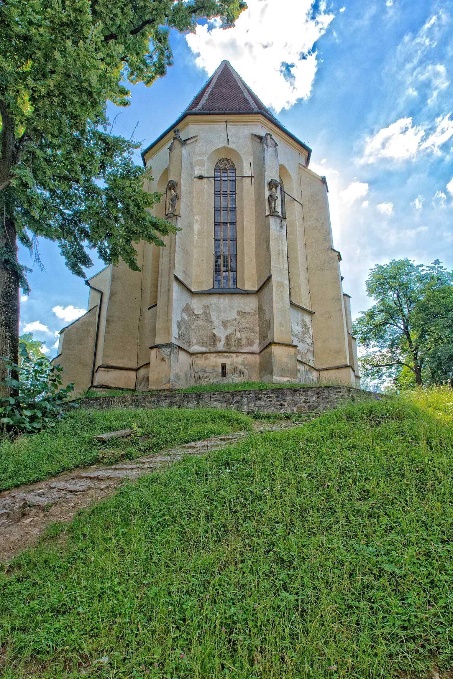 The exterior of the choir, a section believed by researchers to demonstrate the church's evolution in stages, with architectural details that reveal its long history.