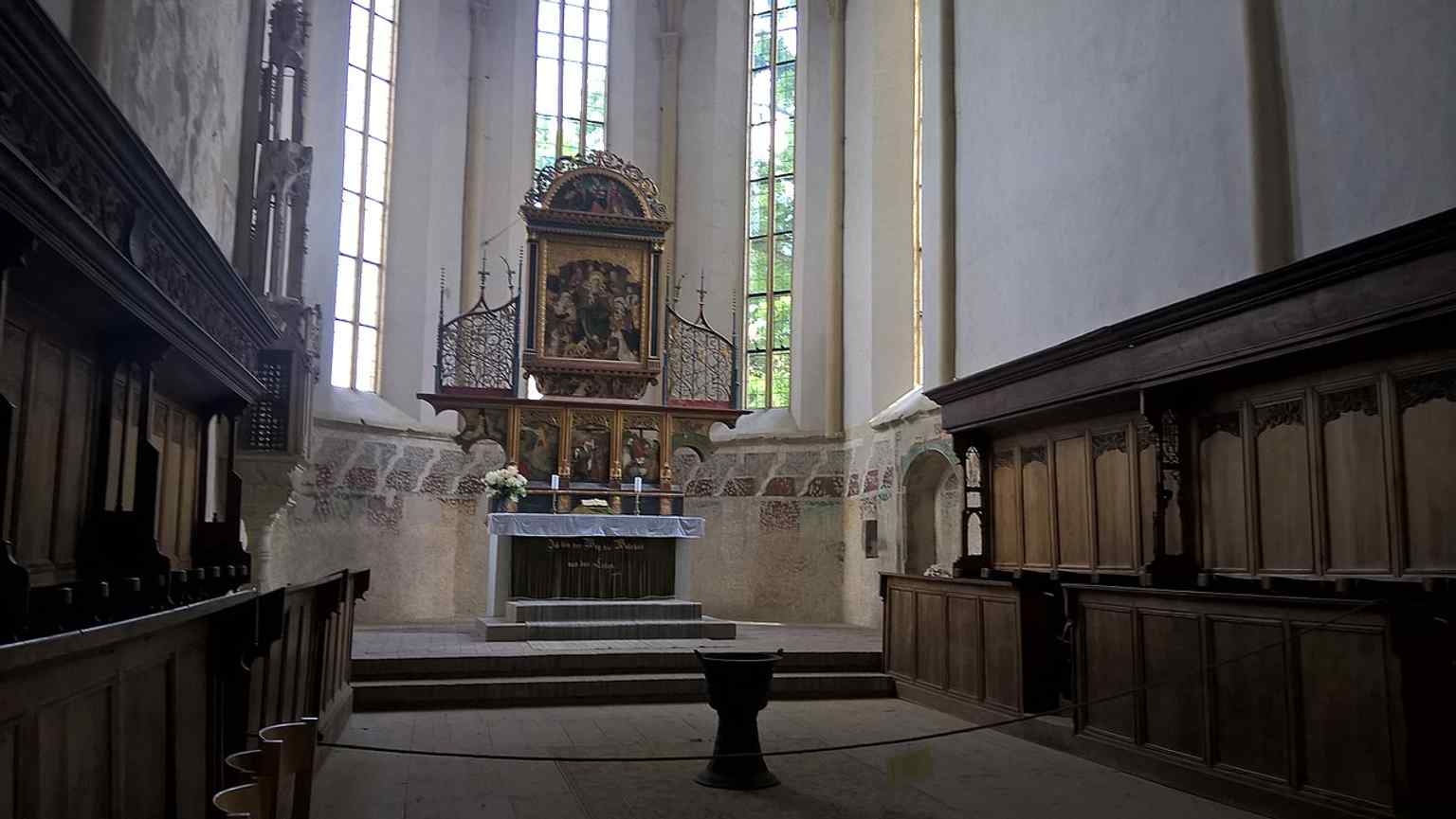 Look up at the choir vaults, rebuilt with painted wooden imitations after the devastating 1838 earthquake, a 'temporary' solution that lasted for over 150 years.